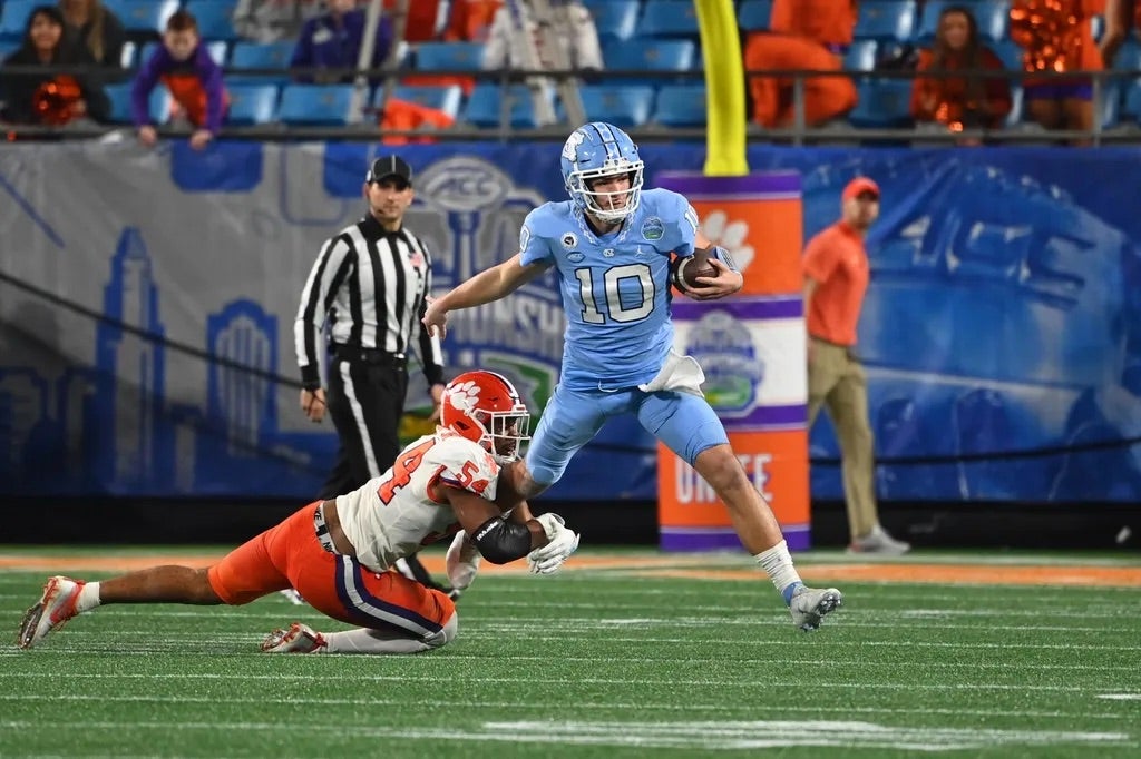 Clemson Tigers linebacker Jeremiah Trotter Jr. (54) tackles North Carolina Tar Heels quarterback Drake Maye (10) in the third quarter at Bank of America Stadium.