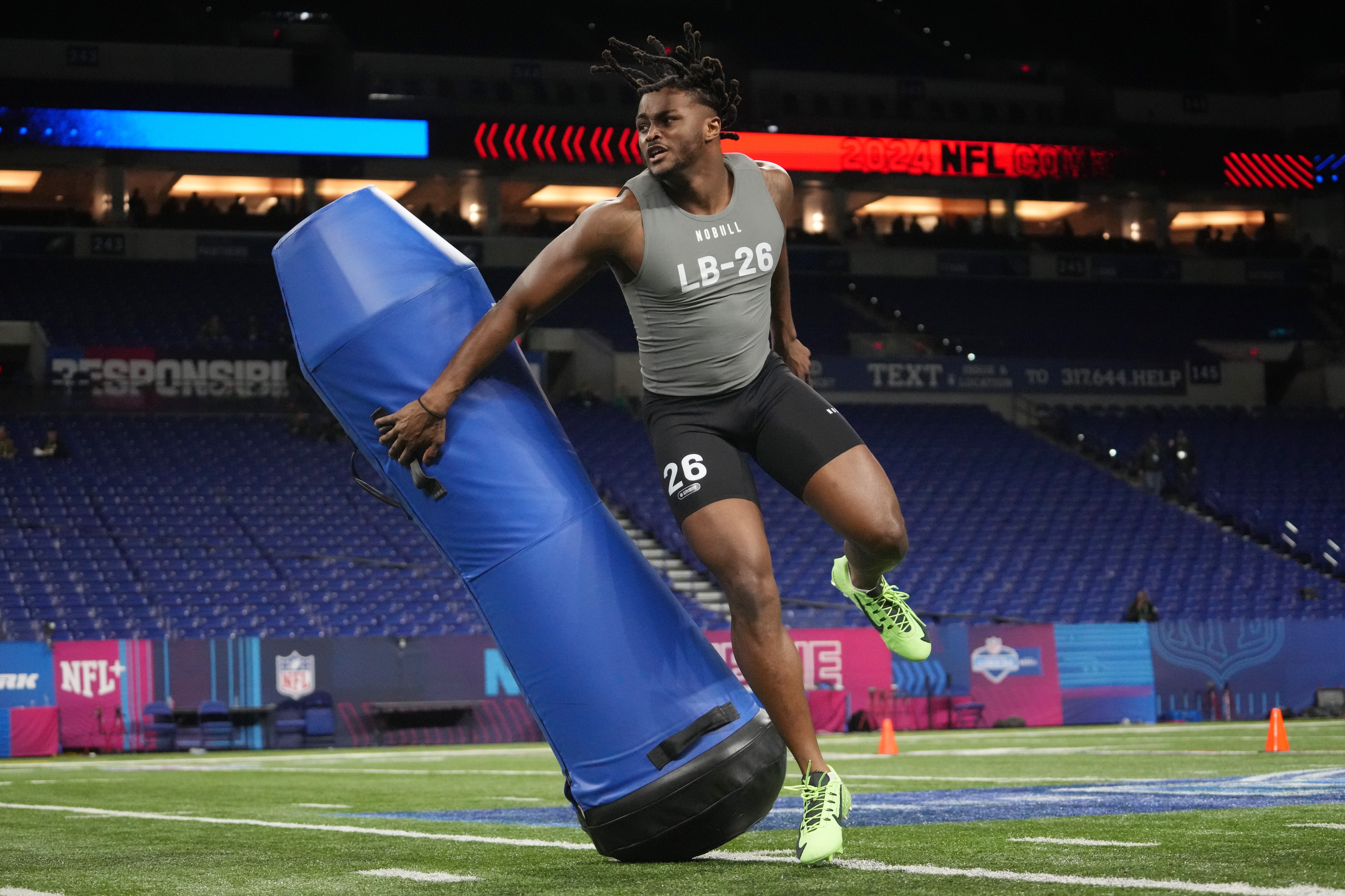 Feb 29, 2024; Indianapolis, IN, USA; Alabama linebacker Dallas Turner (LB26) works out during the 2024 NFL Combine at Lucas Oil Stadium.