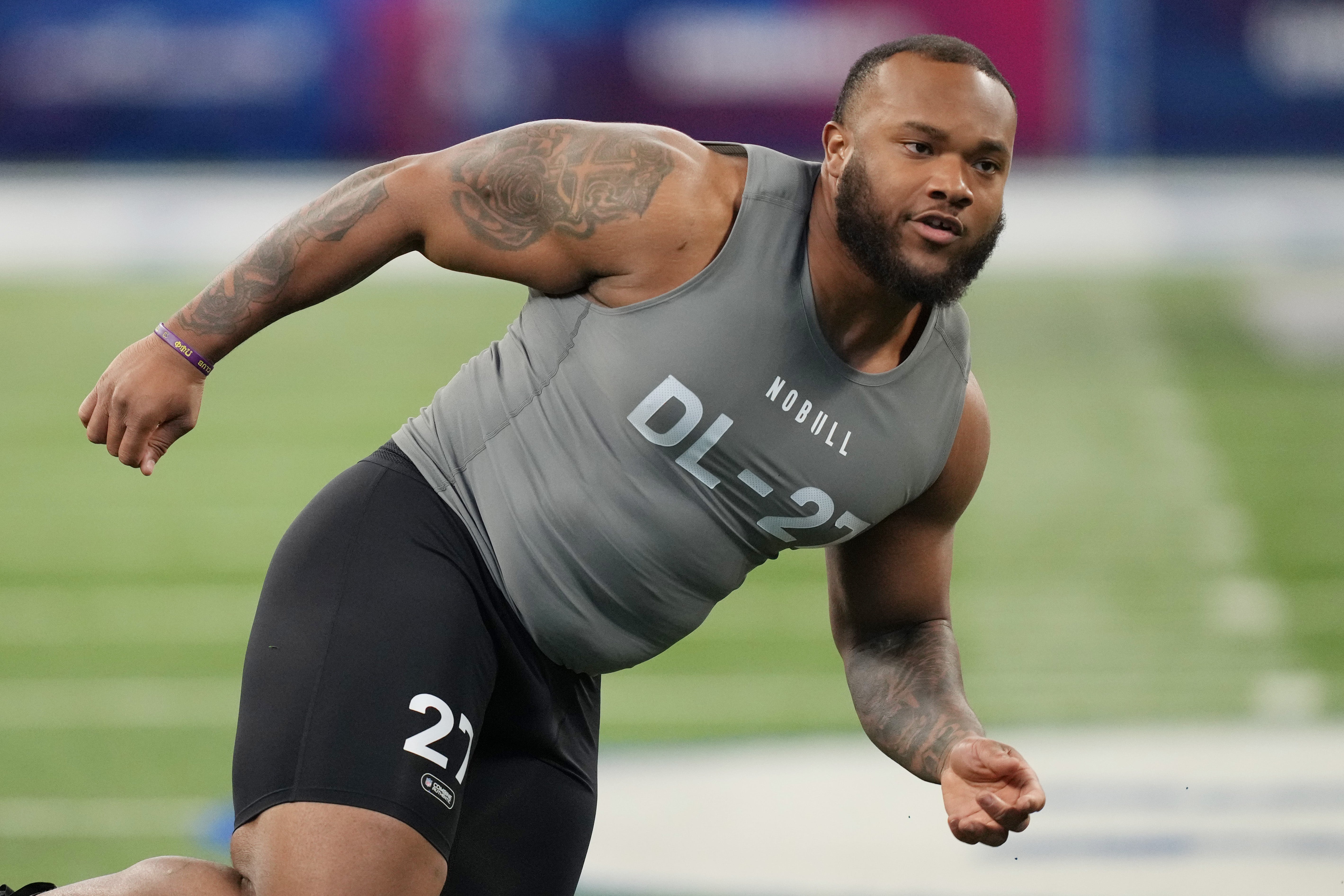 Feb 29, 2024; Indianapolis, IN, USA; Louisiana State defensive lineman Mekhi Wingo (DL27) works out during the 2024 NFL Combine at Lucas Oil Stadium.