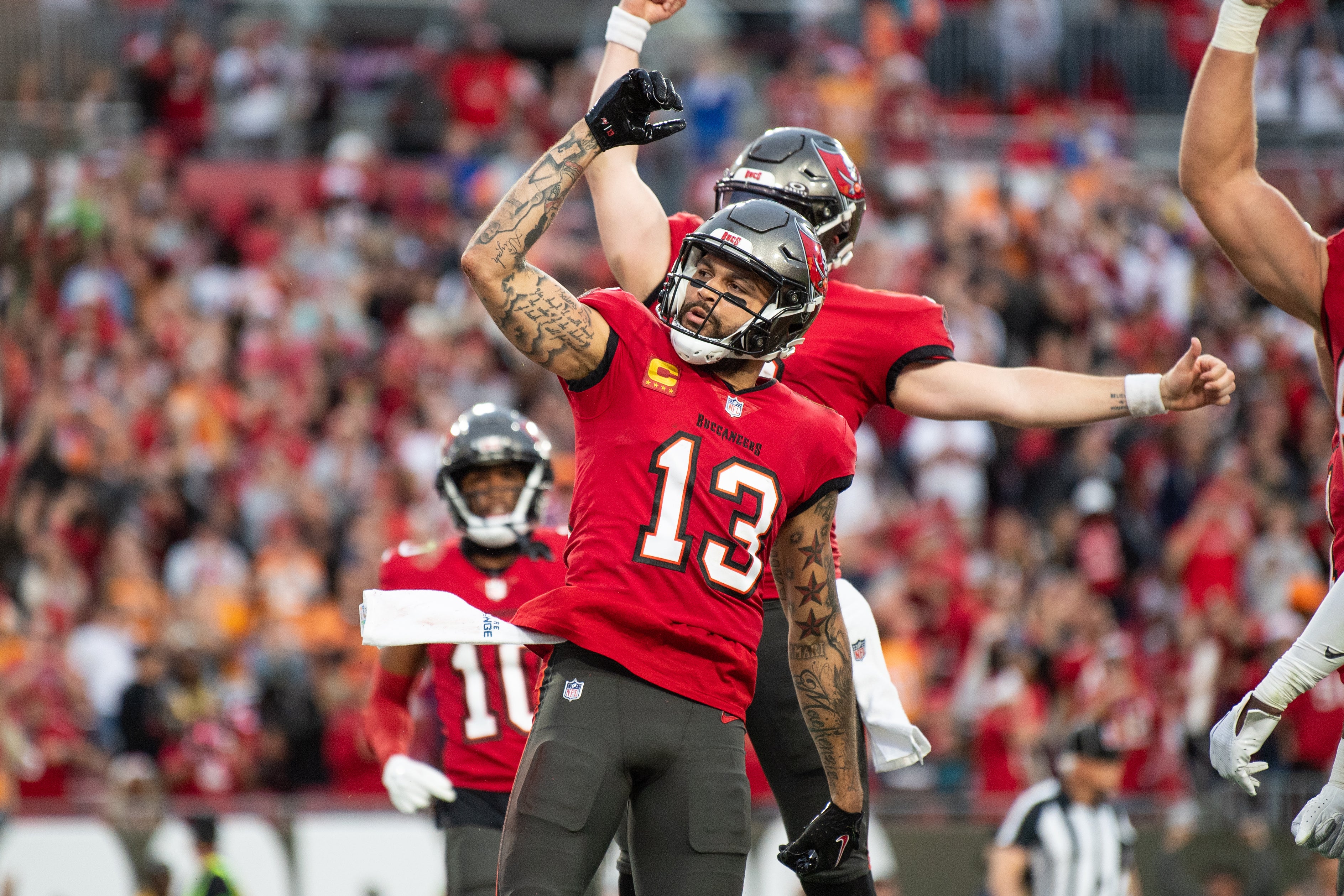 Dec 24, 2023; Tampa, Florida, USA; Tampa Bay Buccaneers wide receiver Mike Evans (13) celebrates the touchdown against the Jacksonville Jaguars in the second quarter at Raymond James Stadium.