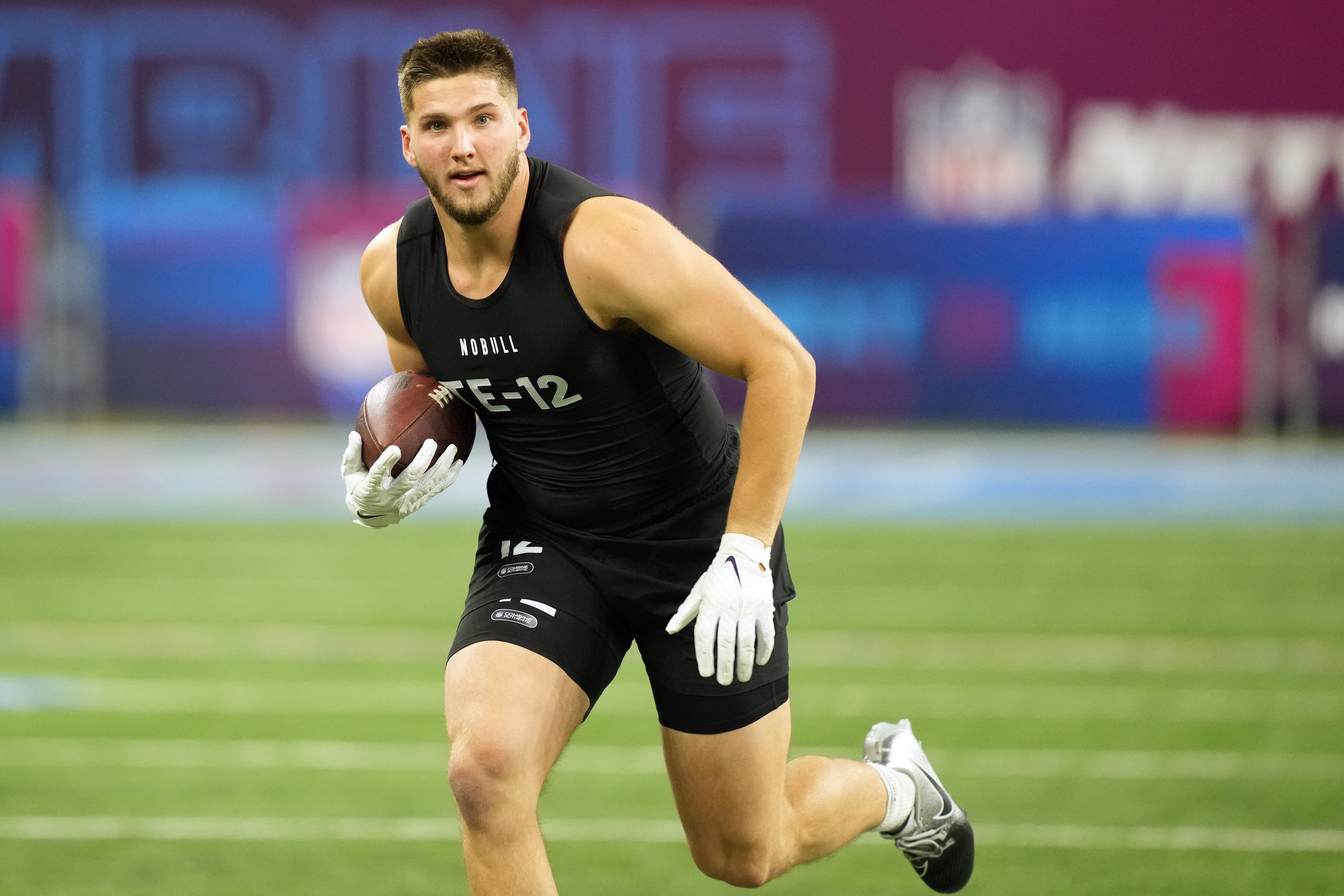 Mar 1, 2024; Indianapolis, IN, USA; Kansas State tight end Ben Sinnott (TE12) works out during the 2024 NFL Combine at Lucas Oil Stadium.