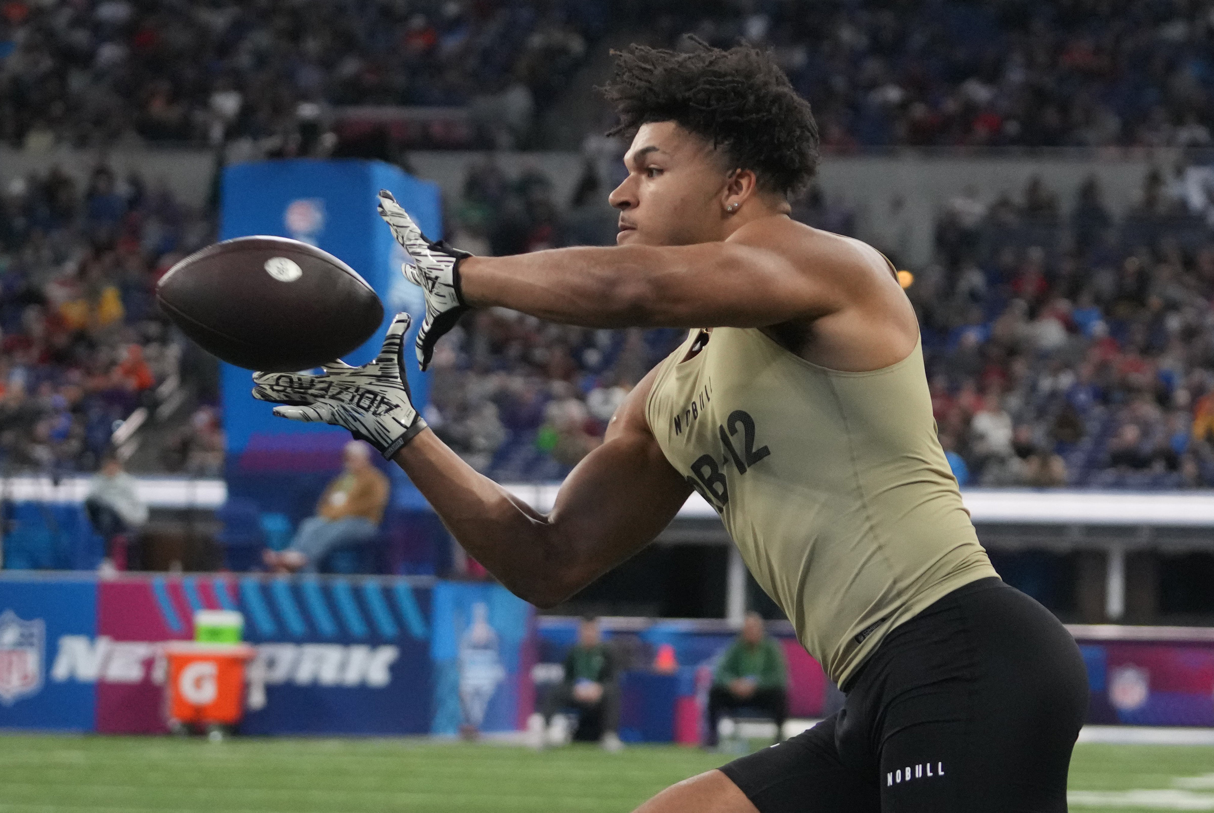 Mar 2, 2024; Indianapolis, IN, USA; Louisville running back Isaac Guerendo (RB12) during the 2024 NFL Combine at Lucas Oil Stadium.