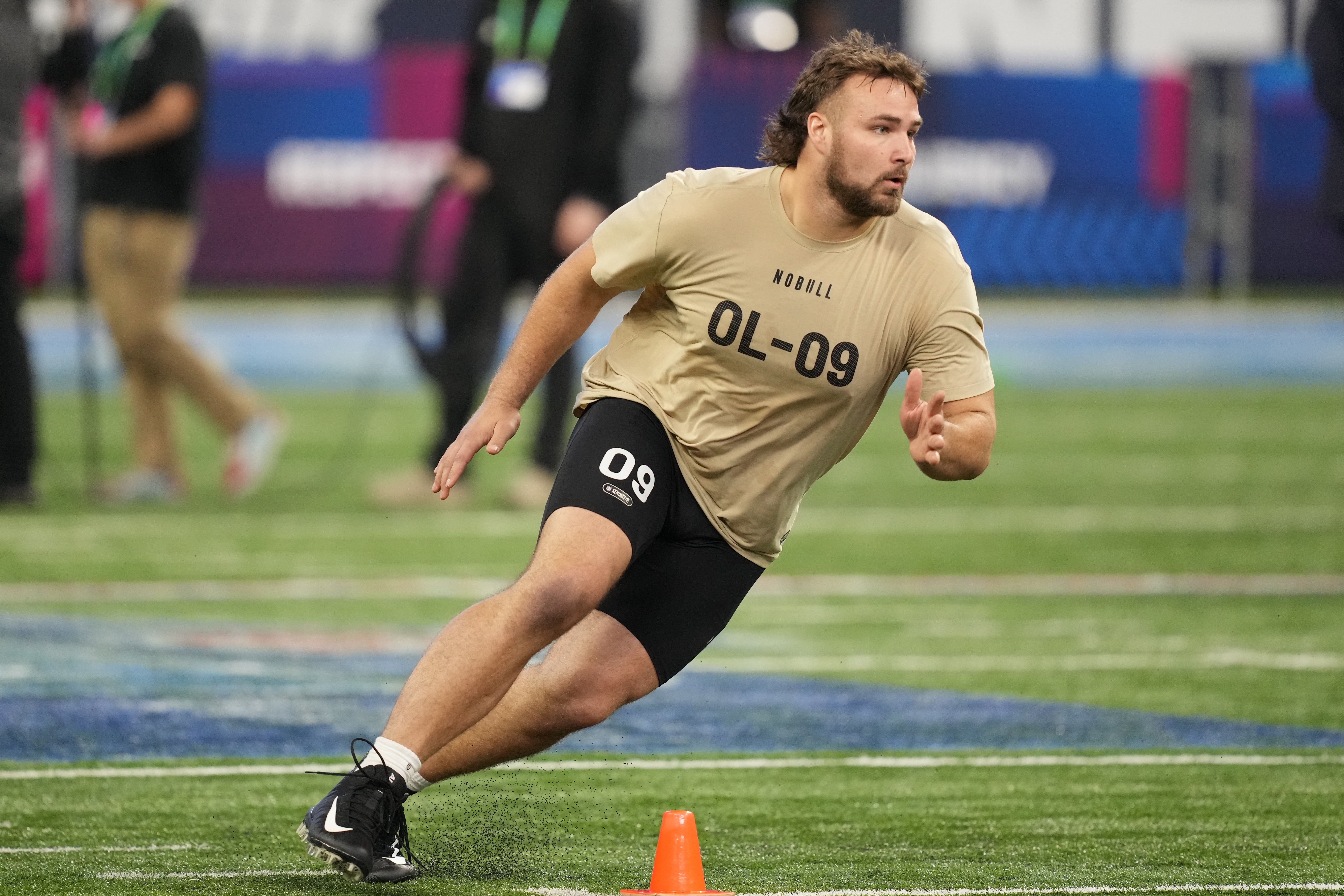 Mar 3, 2024; Indianapolis, IN, USA; Wisconsin offensive lineman Tanor Bortolini (OL09) during the 2024 NFL Combine at Lucas Oil Stadium.