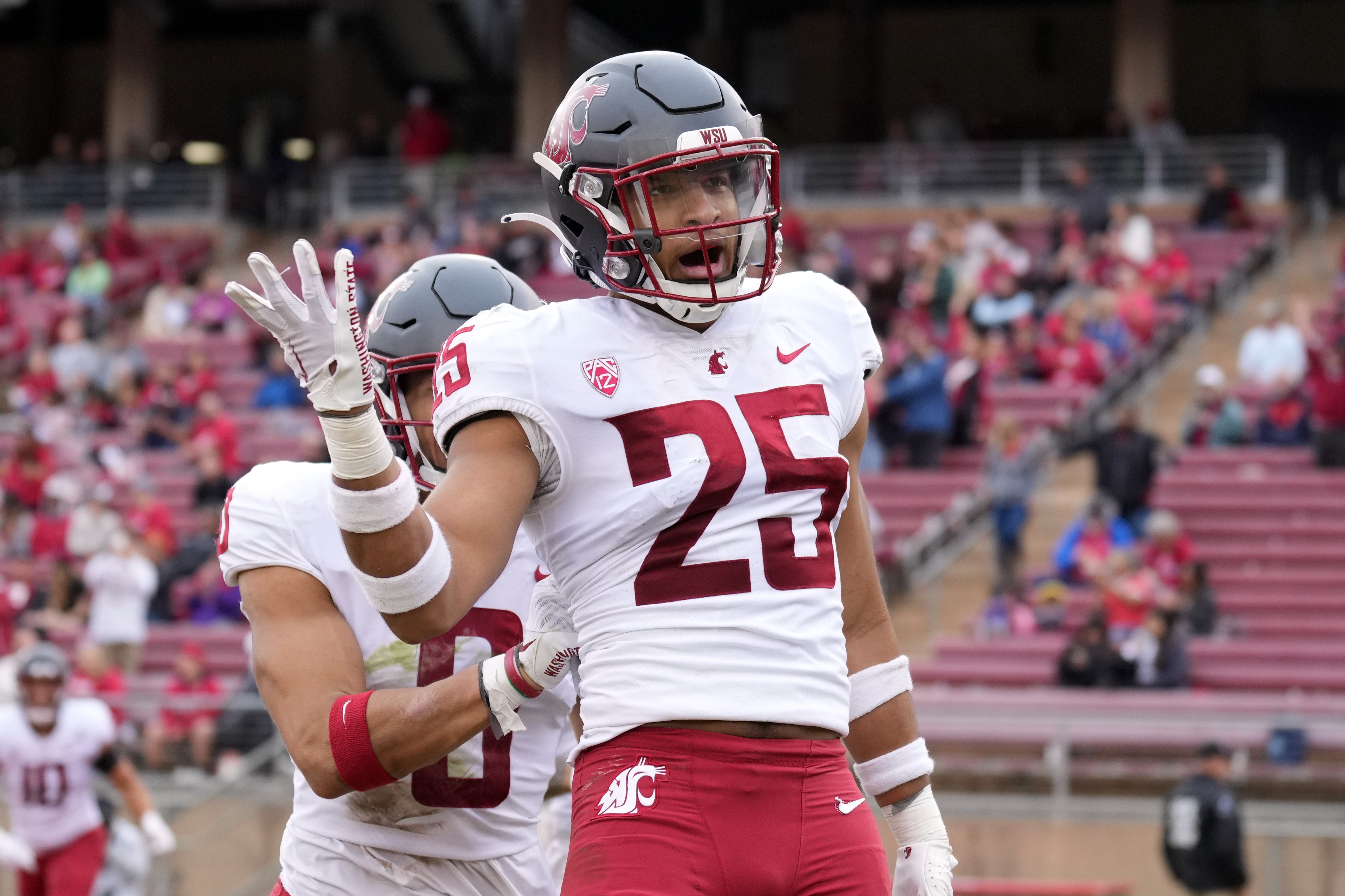 Nov 5, 2022; Stanford, California, USA; Washington State Cougars defensive back Jaden Hicks (25) celebrates after scoring a touchdown against the Stanford Cardinal during the second quarter at Stanford Stadium.