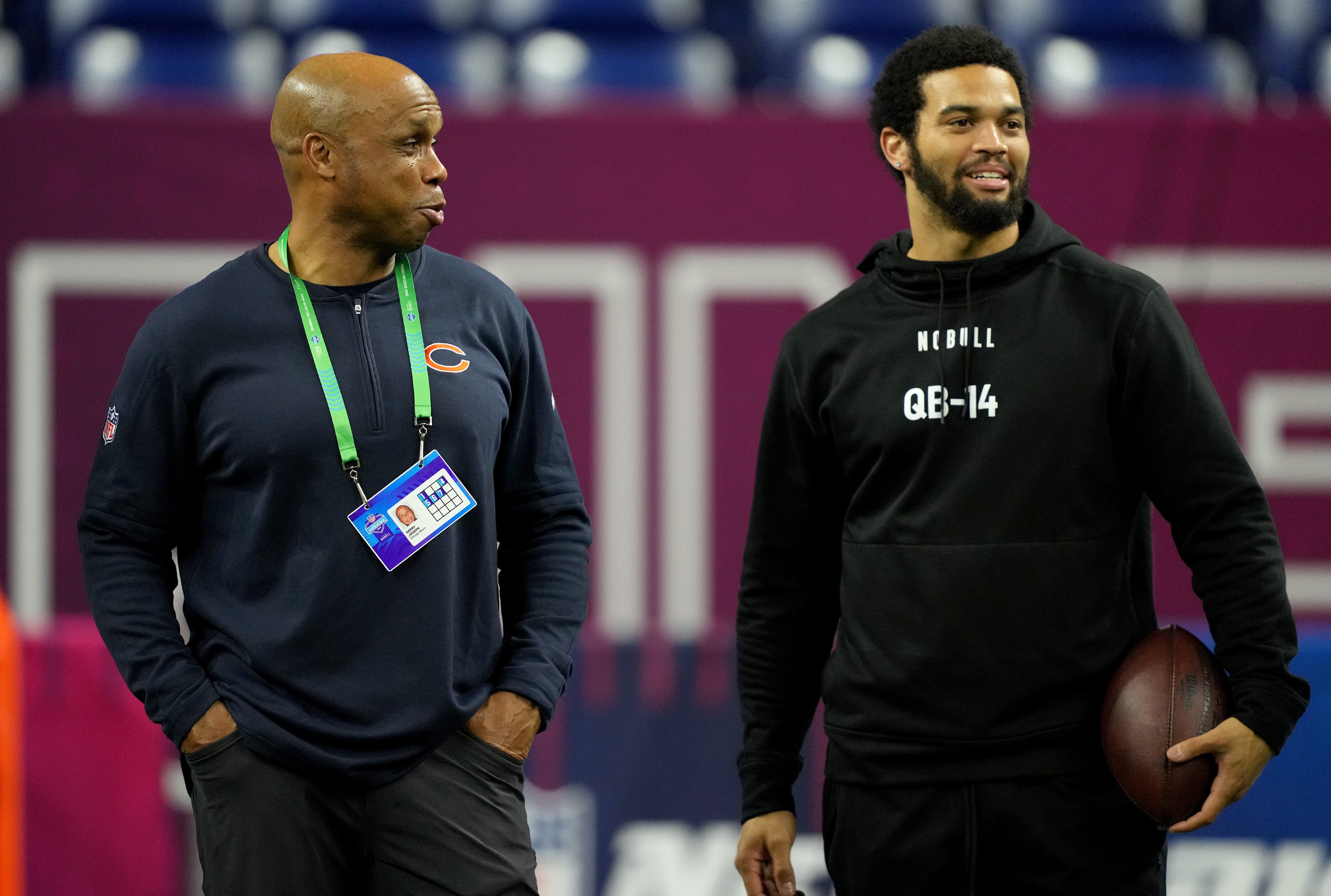 Mar 2, 2024; Indianapolis, IN, USA; Chicago Bears quarterbacks coach Kerry Joseph talks to Southern California quarterback Caleb Williams (QB14) during the 2024 NFL Combine at Lucas Oil Stadium.
