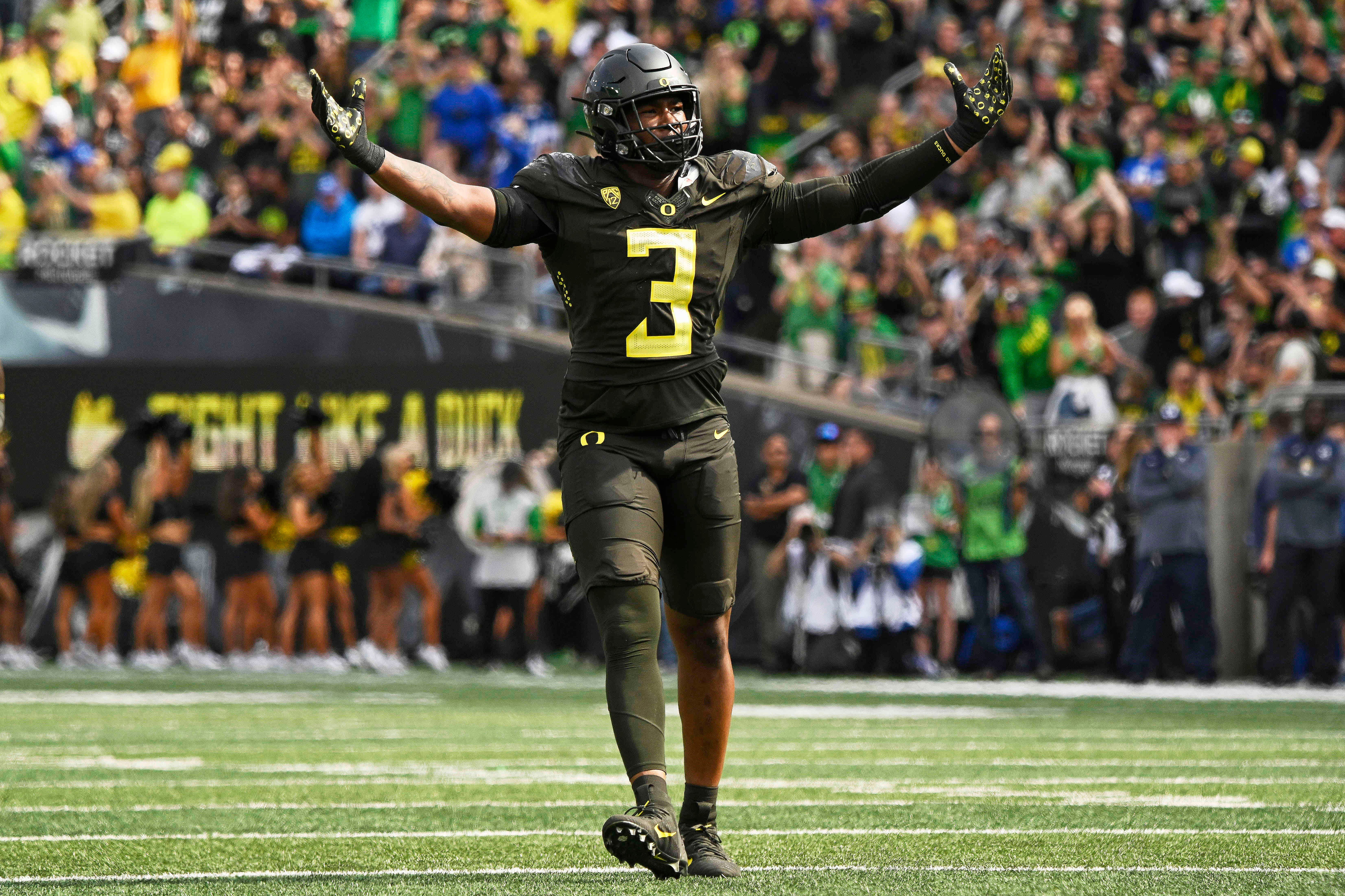 Sep 17, 2022; Eugene, Oregon, USA; Oregon Ducks defensive end Brandon Dorlus (3) celebrates after a defensive stop against the Brigham Young Cougars at Autzen Stadium. Oregon won the game 41-20.