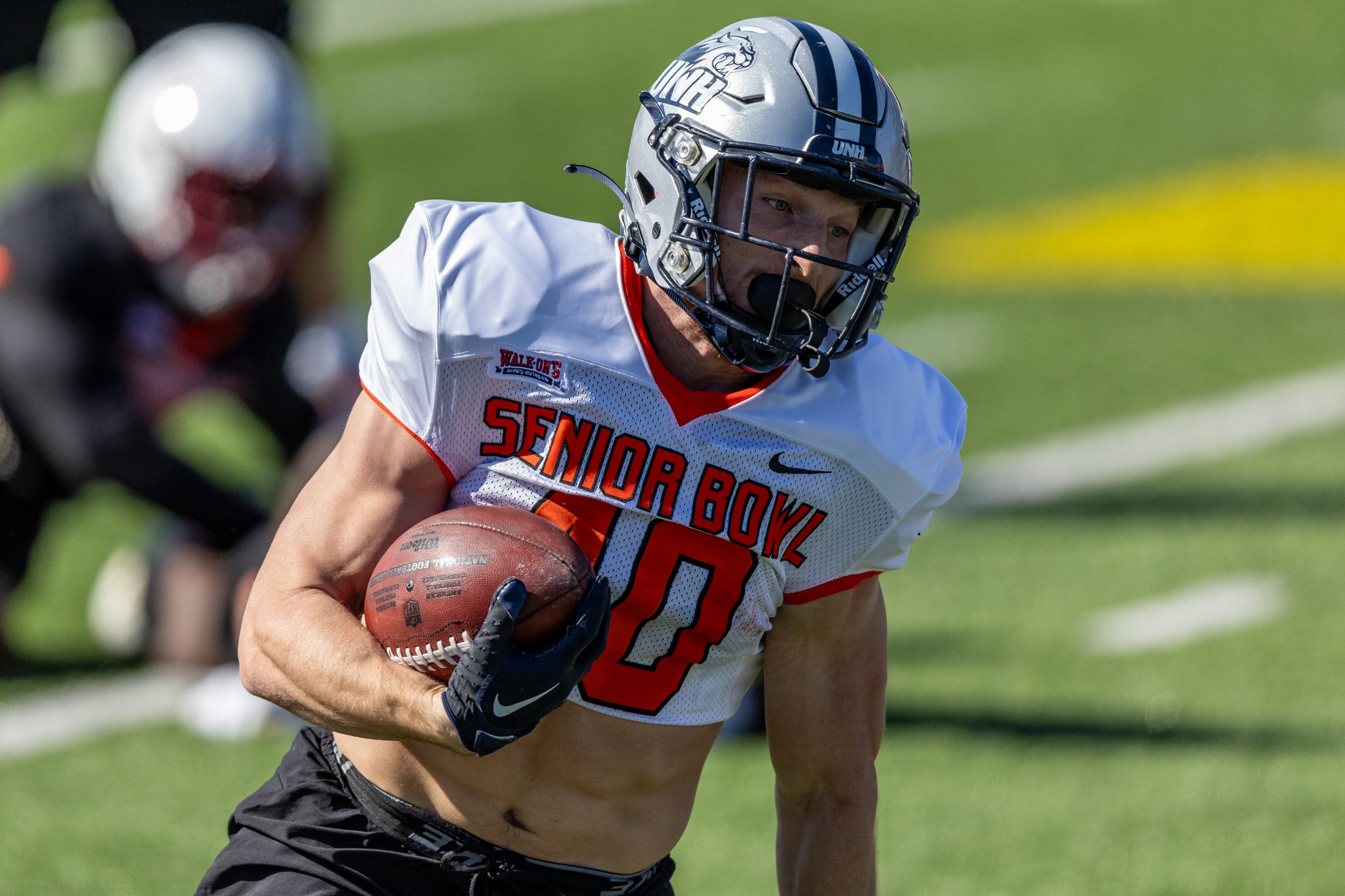 Jan 30, 2024; Mobile, AL, USA; National running back Dylan Laube of New Hampshire (40) runs the ball during practice for the National team at Hancock Whitney Stadium.