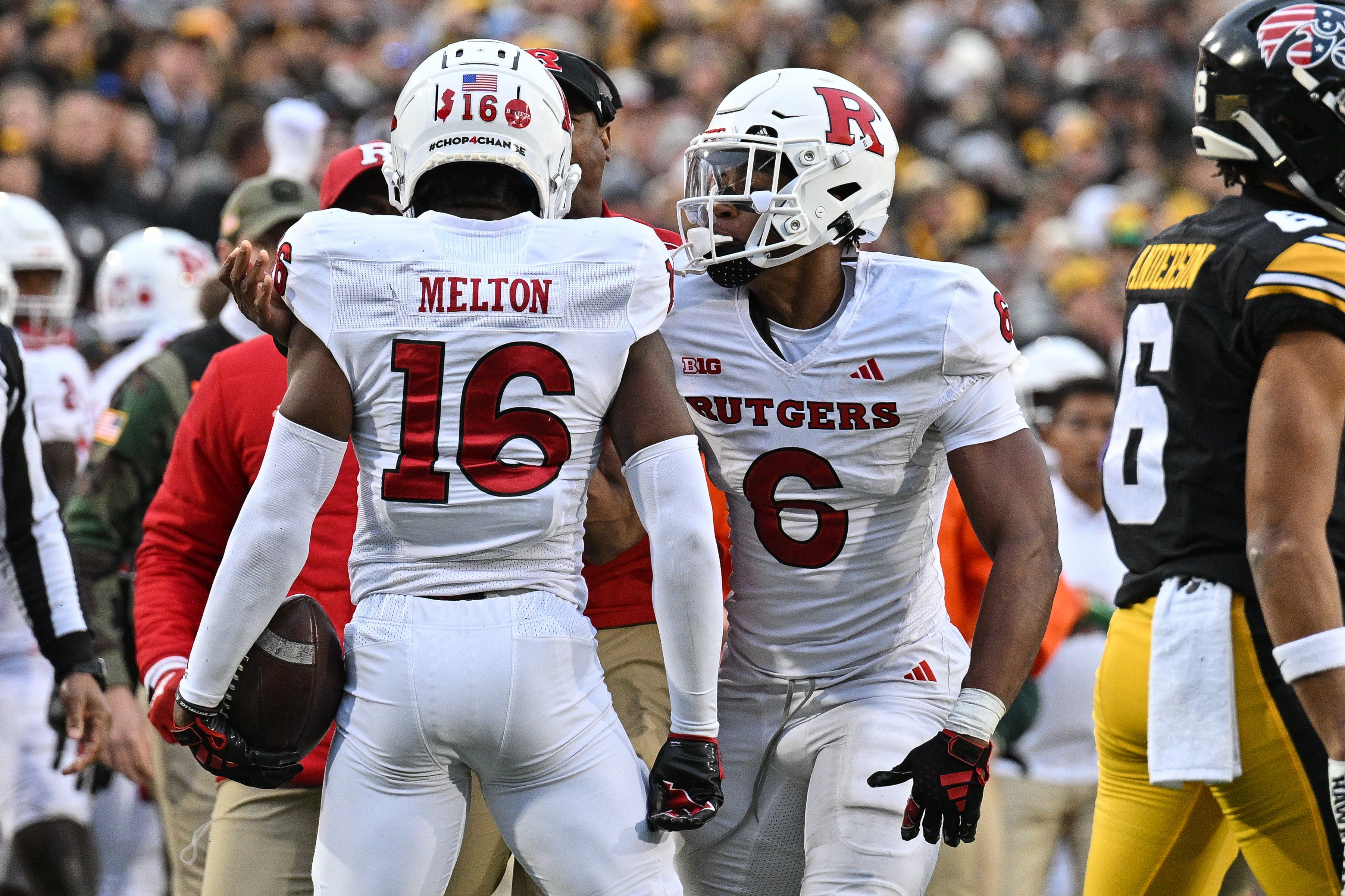 Nov 11, 2023; Iowa City, Iowa, USA; Rutgers Scarlet Knights defensive back Max Melton (16) and defensive back Shaquan Loyal (6) react after Melton intercepts a pass from Iowa Hawkeyes quarterback Deacon Hill (not pictured) during the second quarter at Kinnick Stadium.