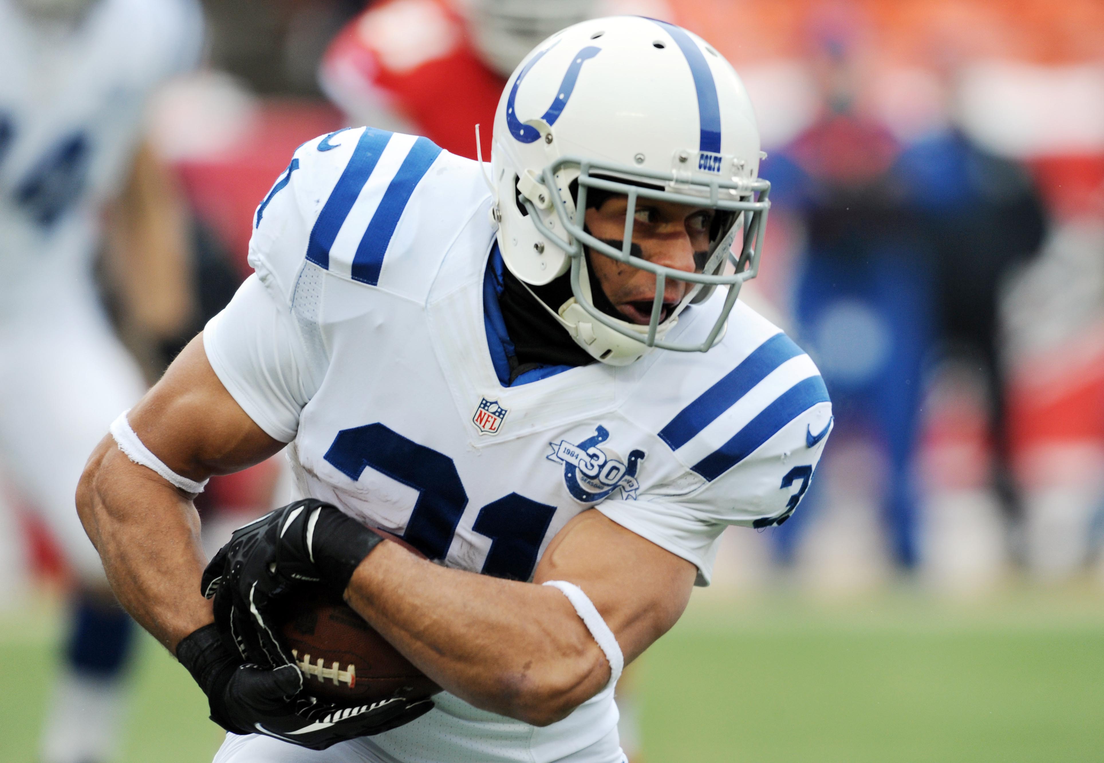 Dec 22, 2013; Kansas City, MO, USA; Indianapolis Colts running back Donald Brown (31) runs the ball during the first half of the game against the Kansas City Chiefs at Arrowhead Stadium.