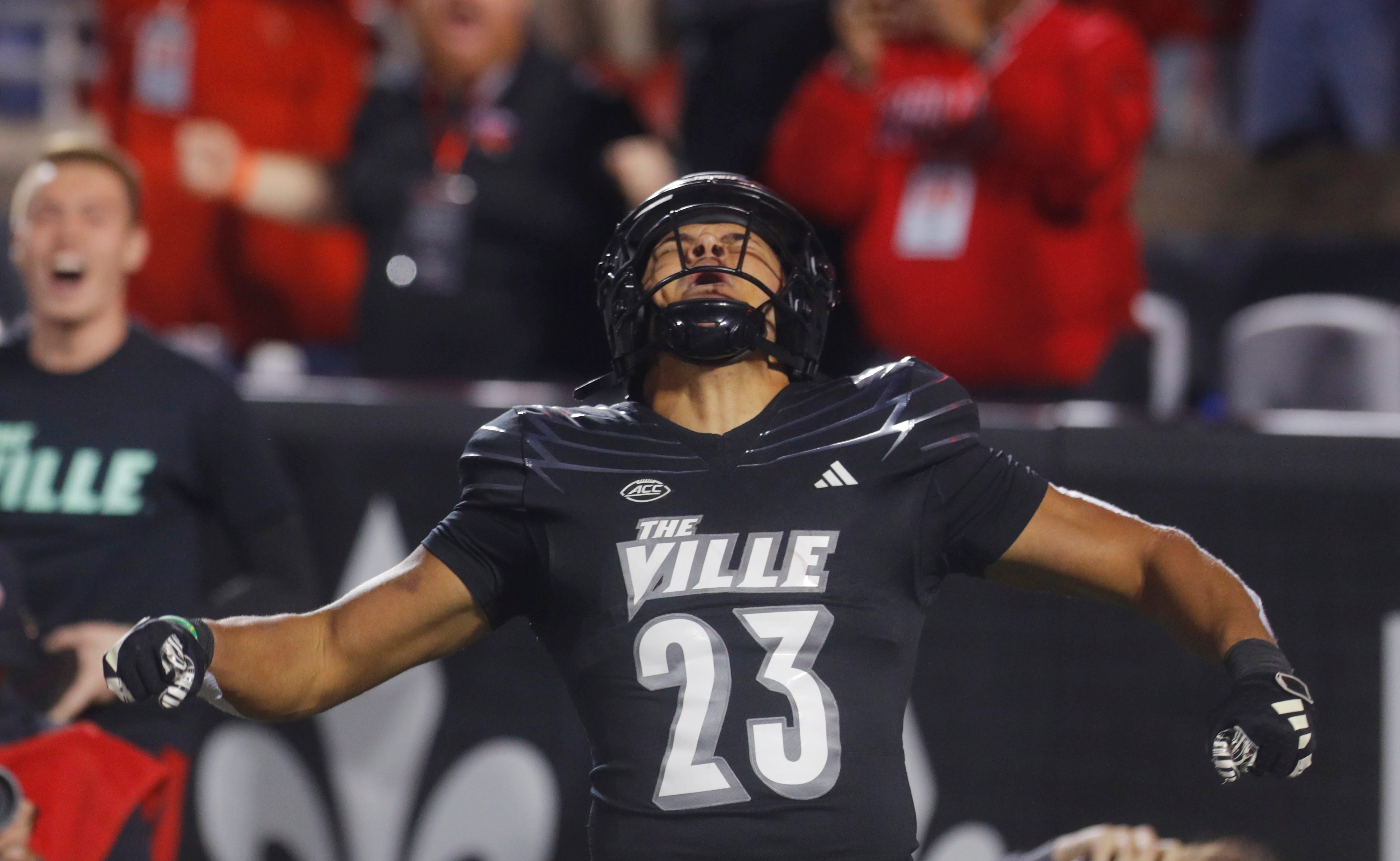 Louisville s Isaac Guerendo celebrated scoring a touchdown against Virginia in L & N Stadium. Nov. 9, 2023