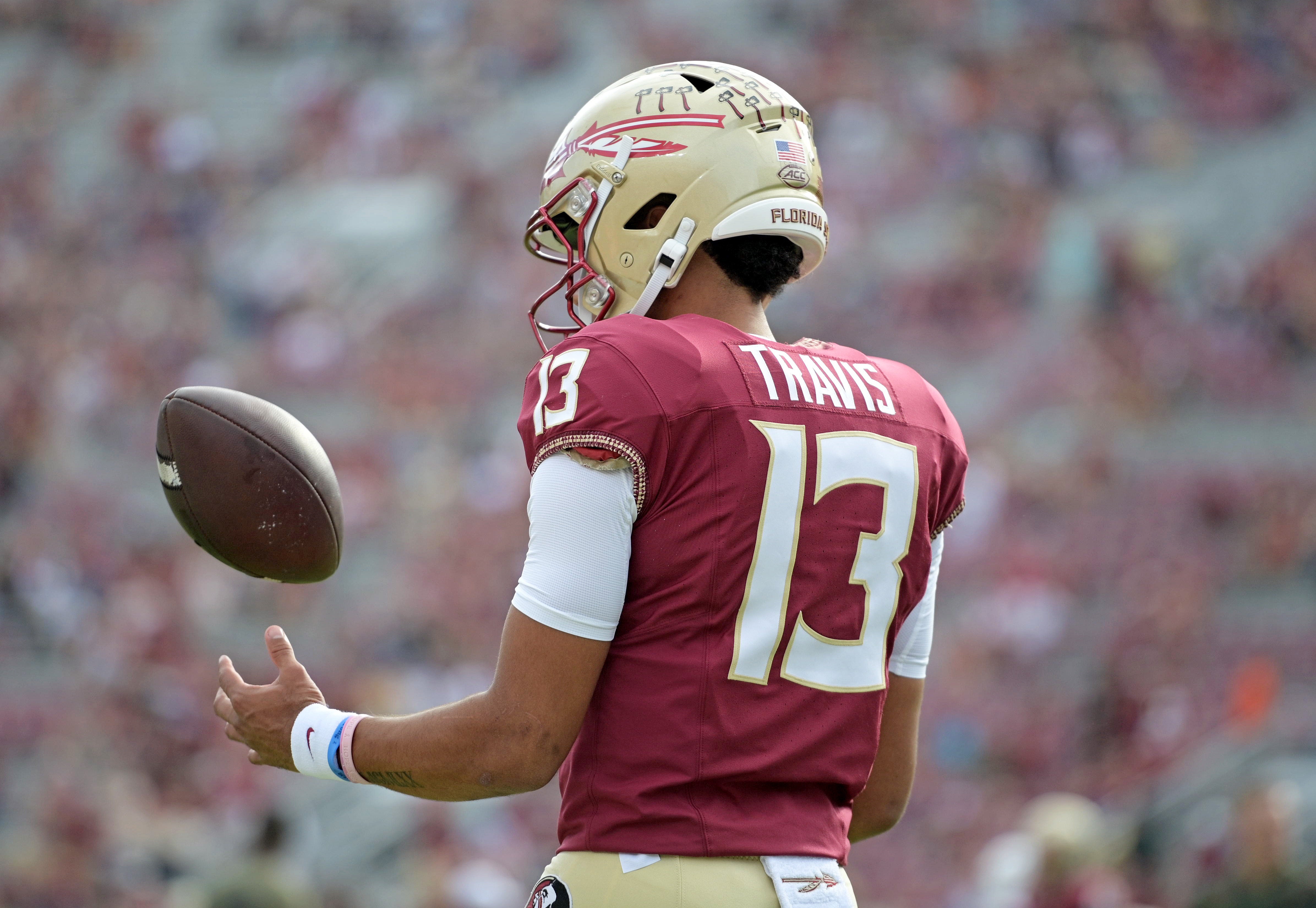 Nov 11, 2023; Tallahassee, Florida, USA; Florida State Seminoles quarterback Jordan Travis (13) takes a moment to himself before the game against the Miami Hurricanes at Doak S. Campbell Stadium.
