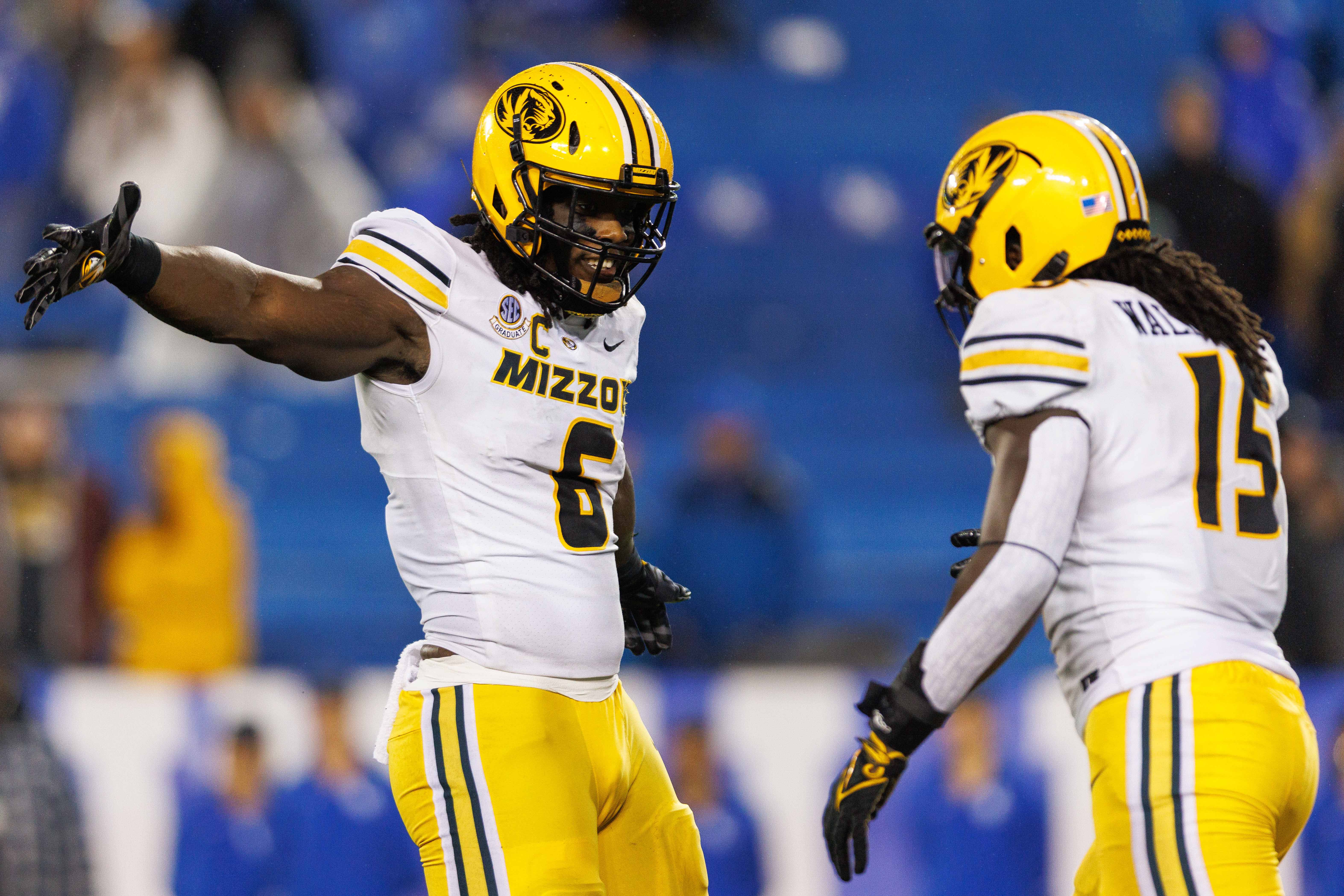 Oct 14, 2023; Lexington, Kentucky, USA; Missouri Tigers defensive lineman Darius Robinson (6) and defensive lineman Johnny Walker Jr. (15) celebrate during the fourth quarter against the Kentucky Wildcats at Kroger Field.