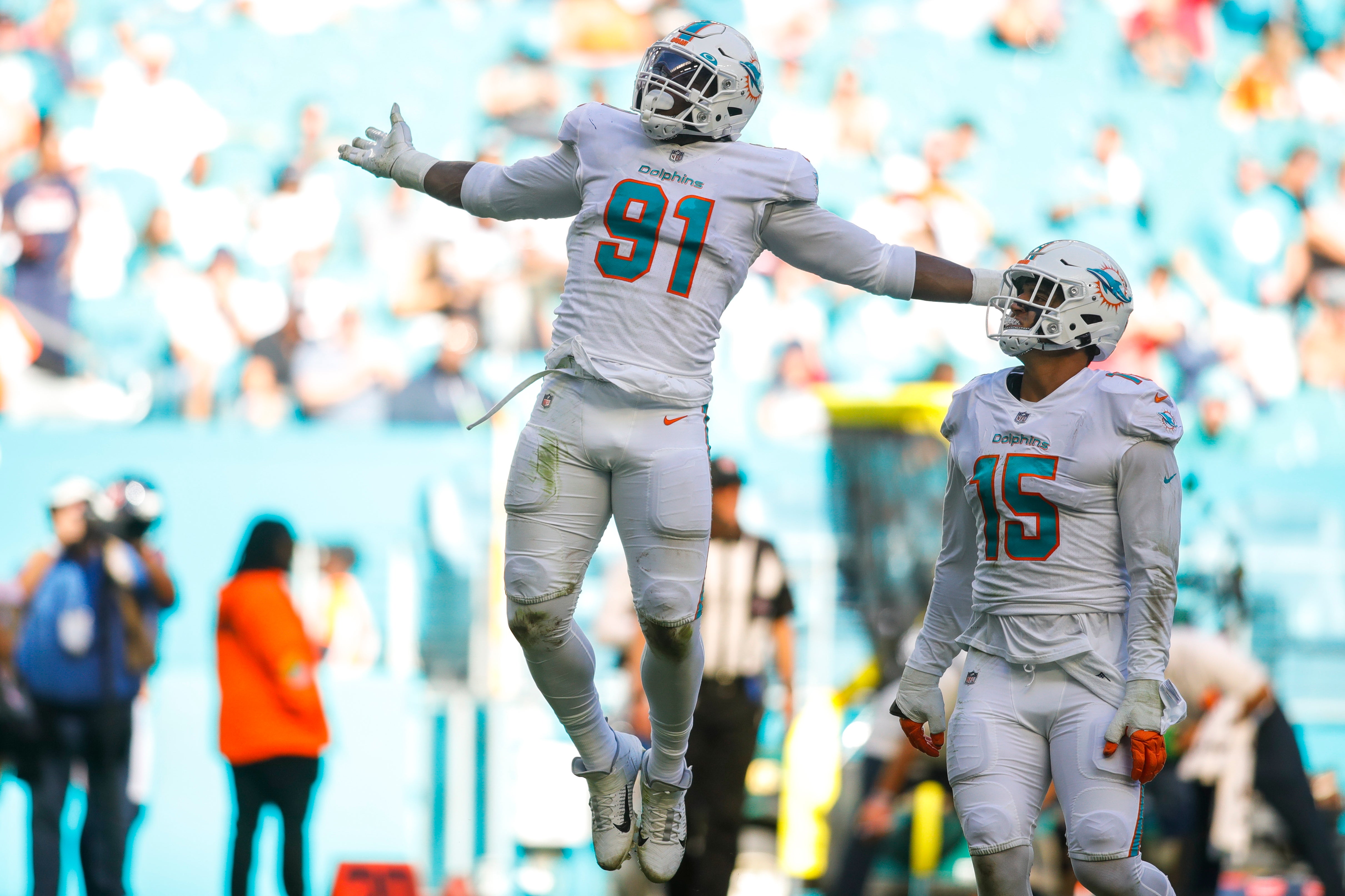 Nov 7, 2021; Miami Gardens, Florida, USA; Miami Dolphins defensive end Emmanuel Ogbah (91) reacts after sacking Houston Texans quarterback Tyrod Taylor (not pictured) during the second quarter of the game at Hard Rock Stadium.
