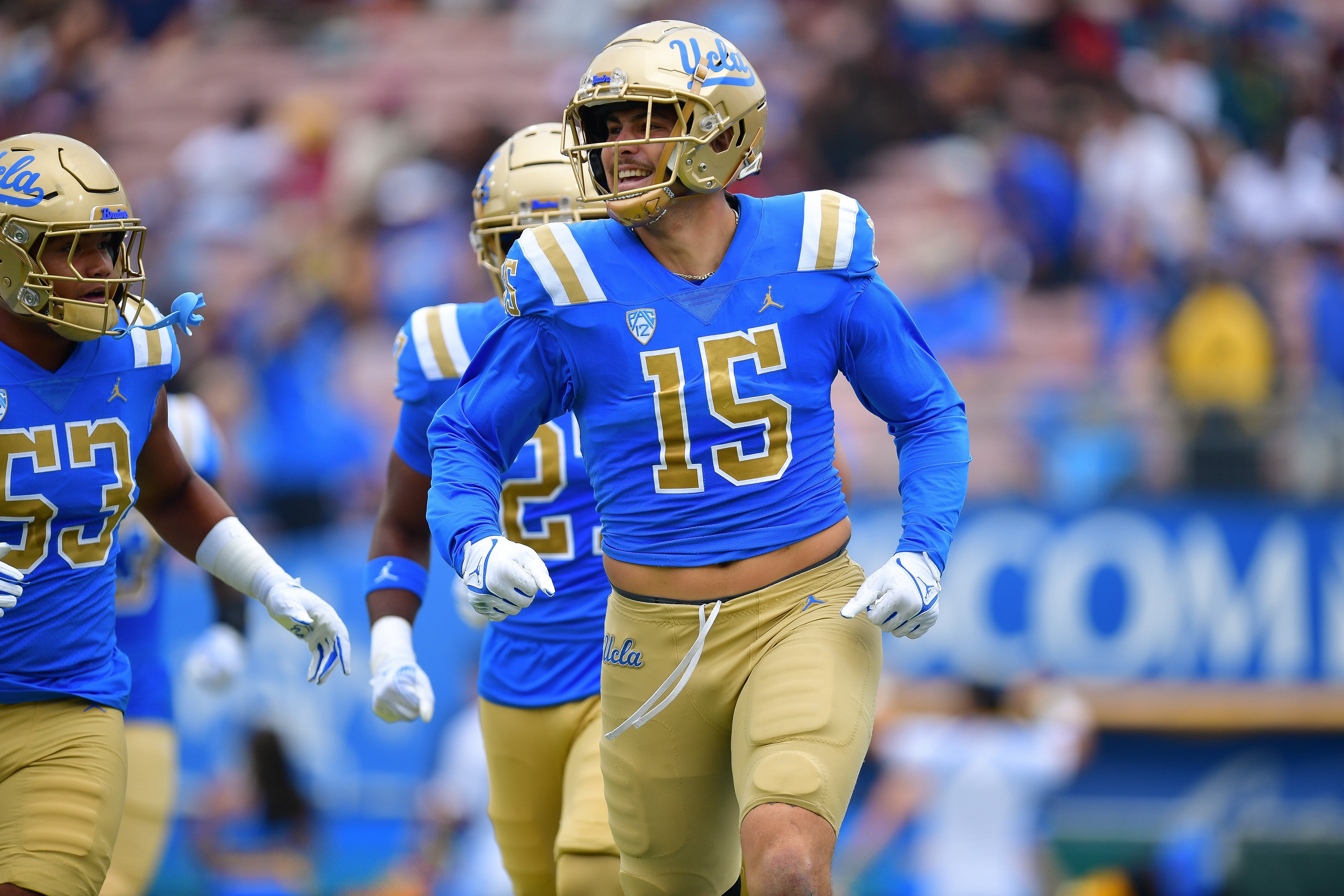 Sep 16, 2023; Pasadena, California, USA; UCLA Bruins defensive lineman Laiatu Latu (15) celebrates after intercepting a pass against the North Carolina Central Eagles during the first half at Rose Bowl.