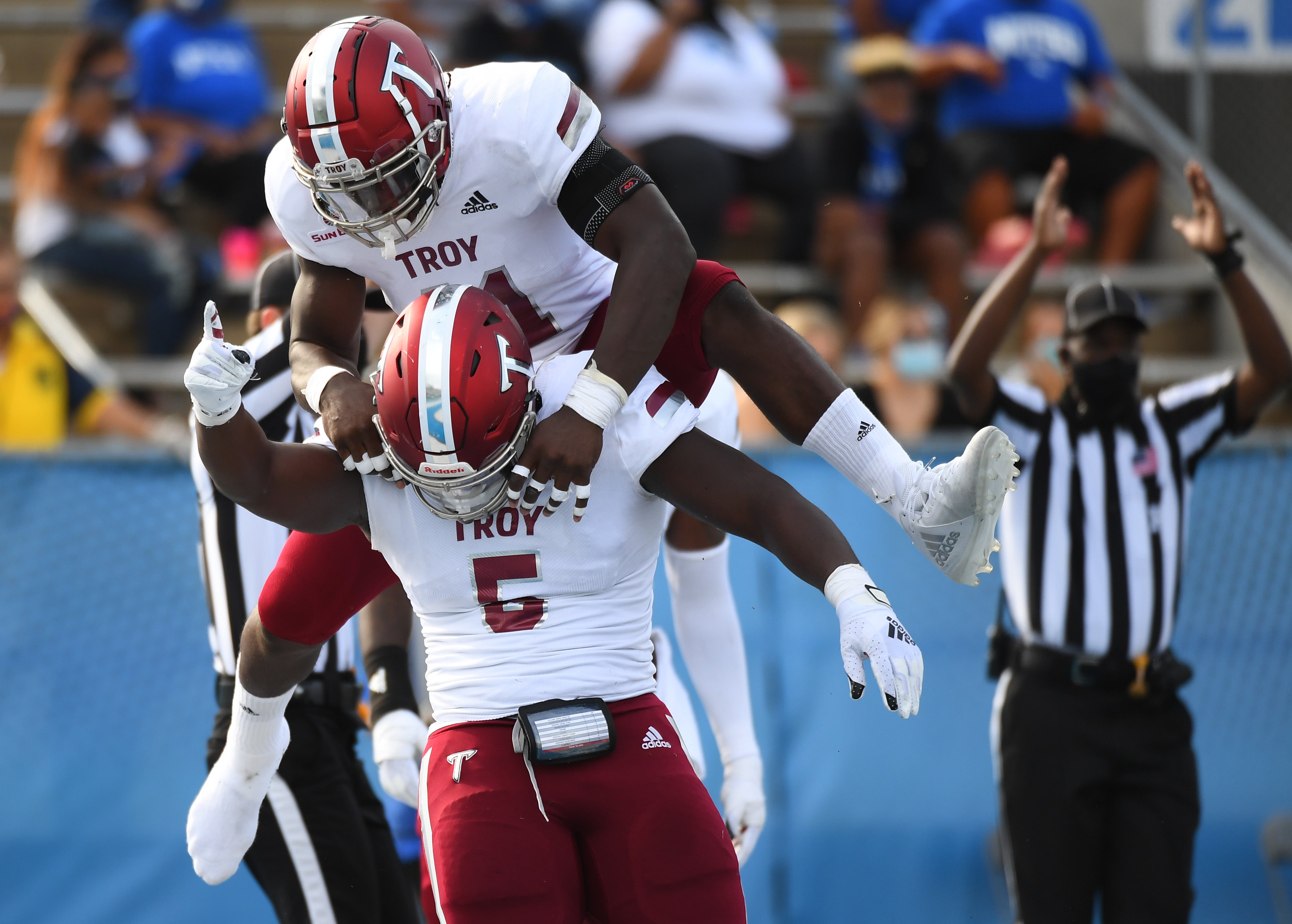 Troy Trojans defensive tackle Will Choloh (5) and Troy Trojans linebacker Javon Solomon (41) celebrate after a safety during the first half against the Middle Tennessee Blue Raiders at Floyd Stadium.