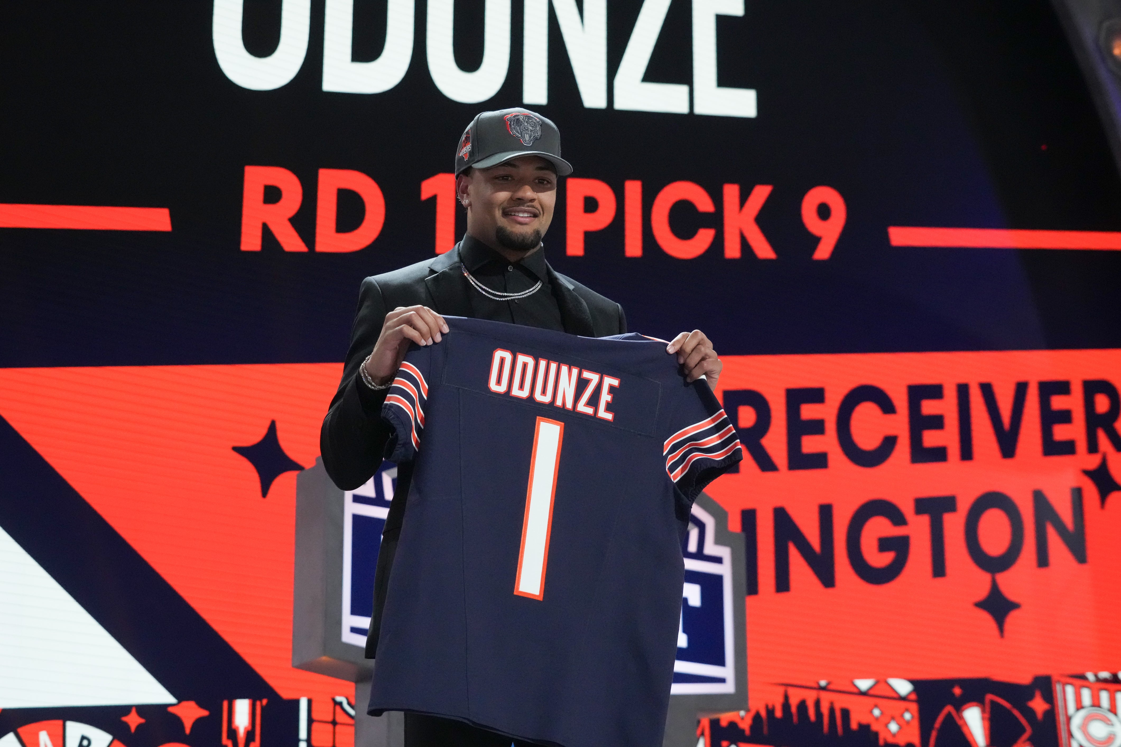Apr 25, 2024; Detroit, MI, USA; Washington Huskies wide receiver Rome Odunze poses after being selected by the Chicago Bears as the No. 9 pick in the first round of the 2024 NFL Draft at Campus Martius Park and Hart Plaza.