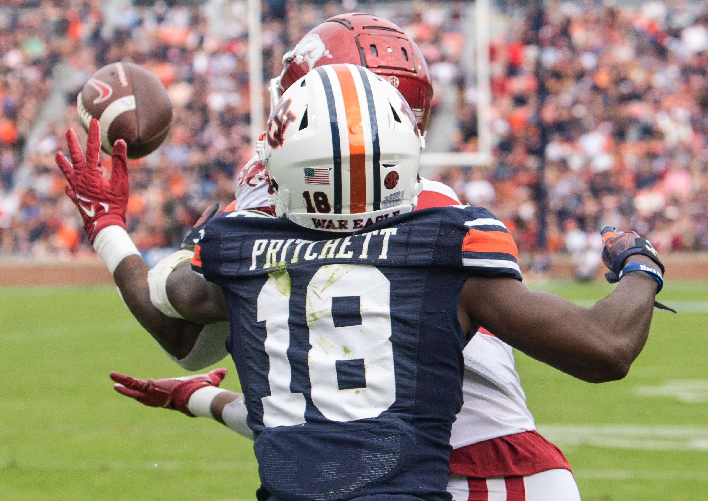 Auburn Tigers defensive back Nehemiah Pritchett (18) is called for defensive pass interference on Arkansas Razorbacks wide receiver Matt Landers (3) as the Auburn Tigers take on Arkansas Razorbacks at Jordan-Hare Stadium in Auburn, Ala., on Saturday, Oct. 29, 2022. Arkansas Razorbacks leads Auburn Tigers 17-13 at halftime.