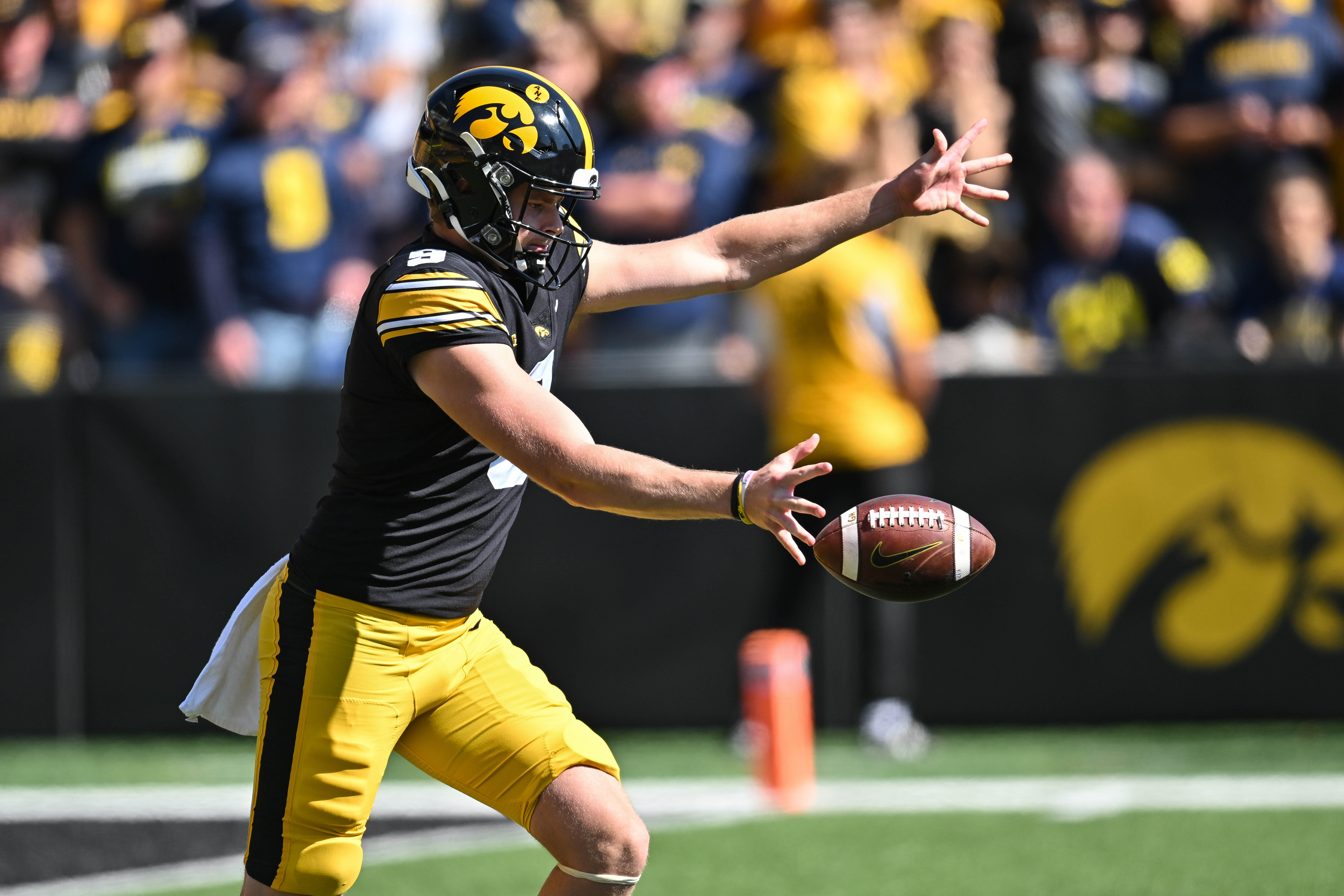 Oct 1, 2022; Iowa City, Iowa, USA; Iowa Hawkeyes punter Tory Taylor (9) in action against the Michigan Wolverines at Kinnick Stadium.