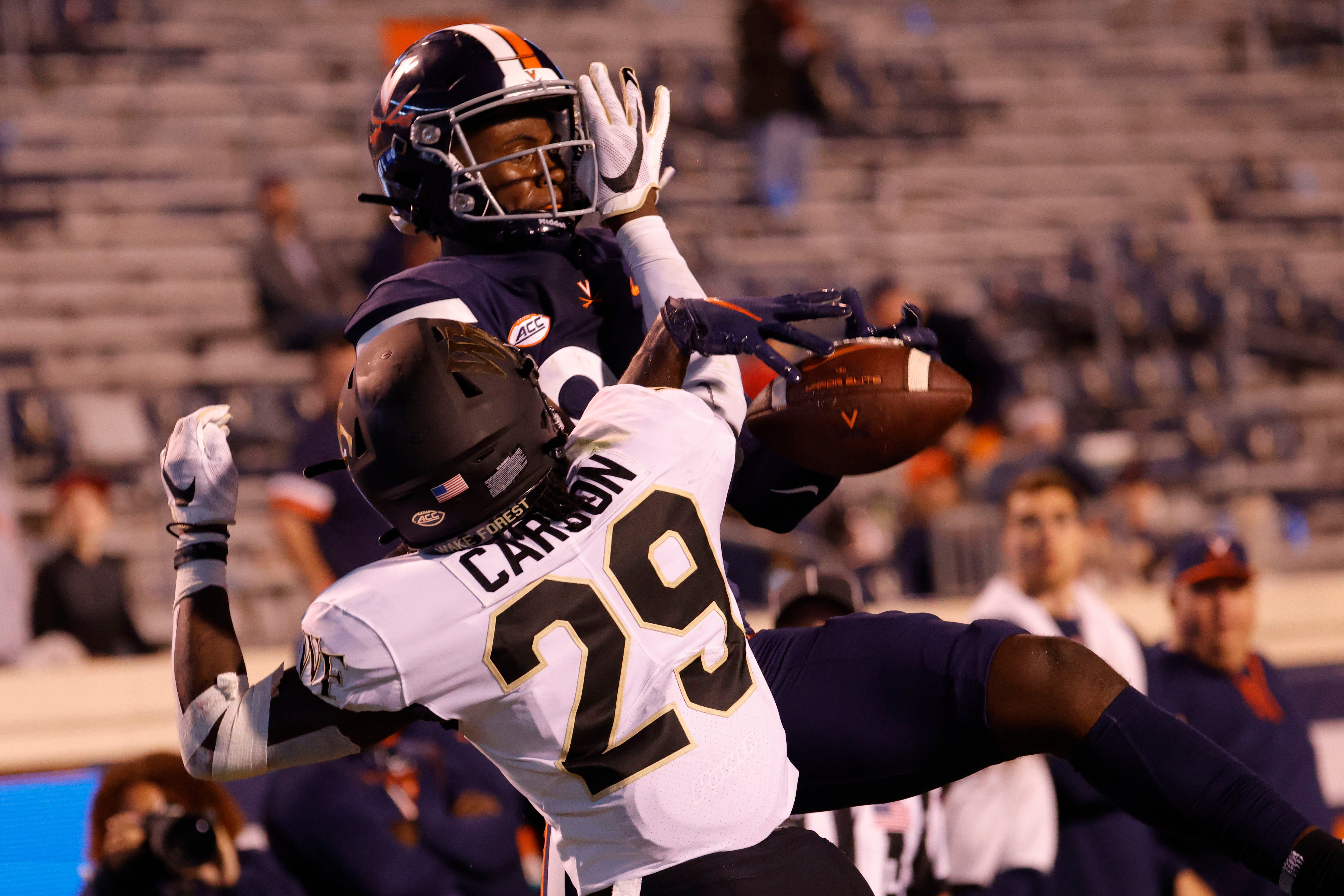 Wake Forest Demon Deacons defensive back Caelen Carson (29) defends a pass in the end zone intended for Virginia Cavaliers wide receiver Malachi Fields (86) during the fourth quarter at Scott Stadium.