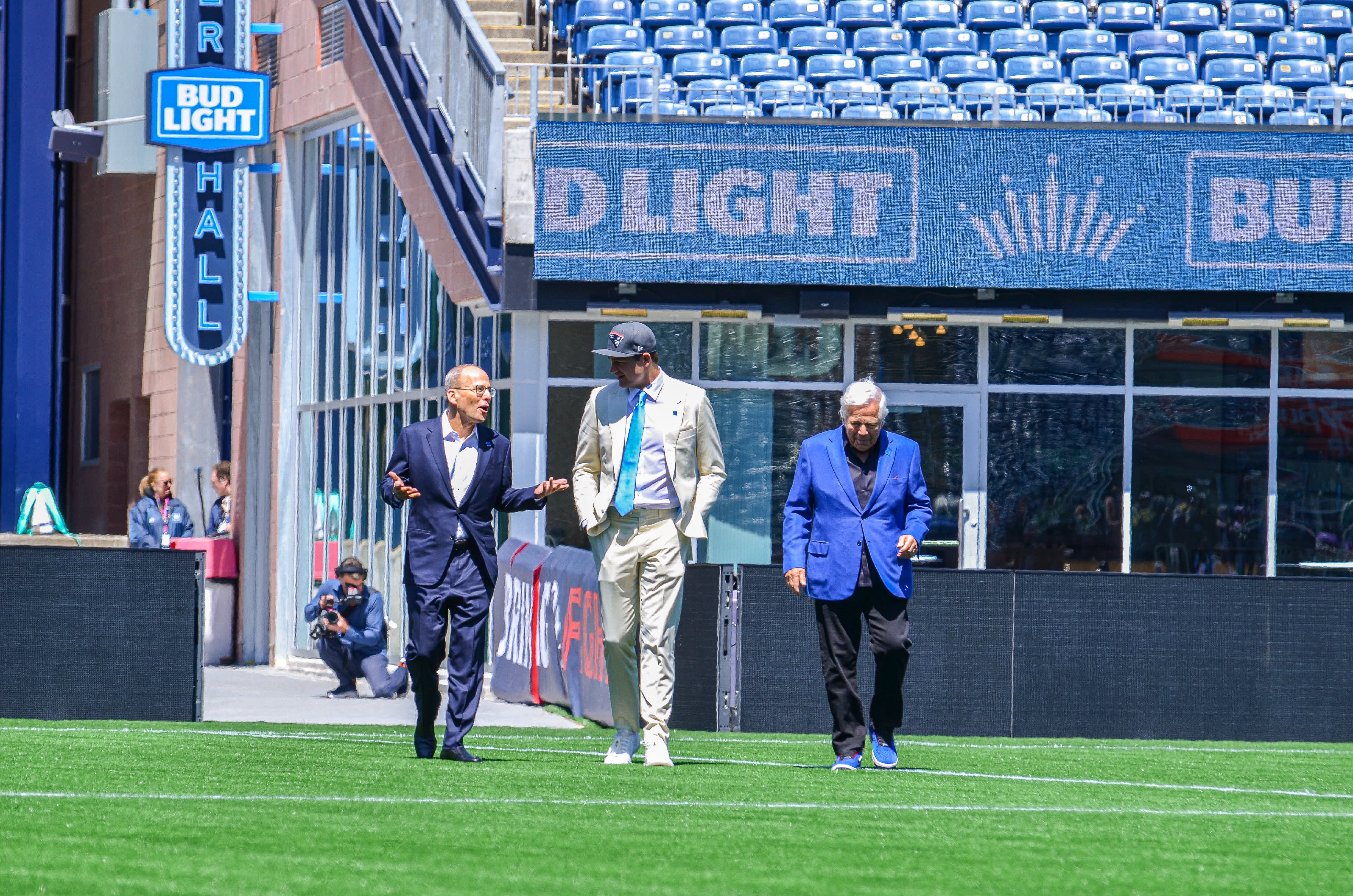 Drake Maye speaks with Jonathan Kraft while walking out onto the field at Gillette Stadium | Friday, April 26