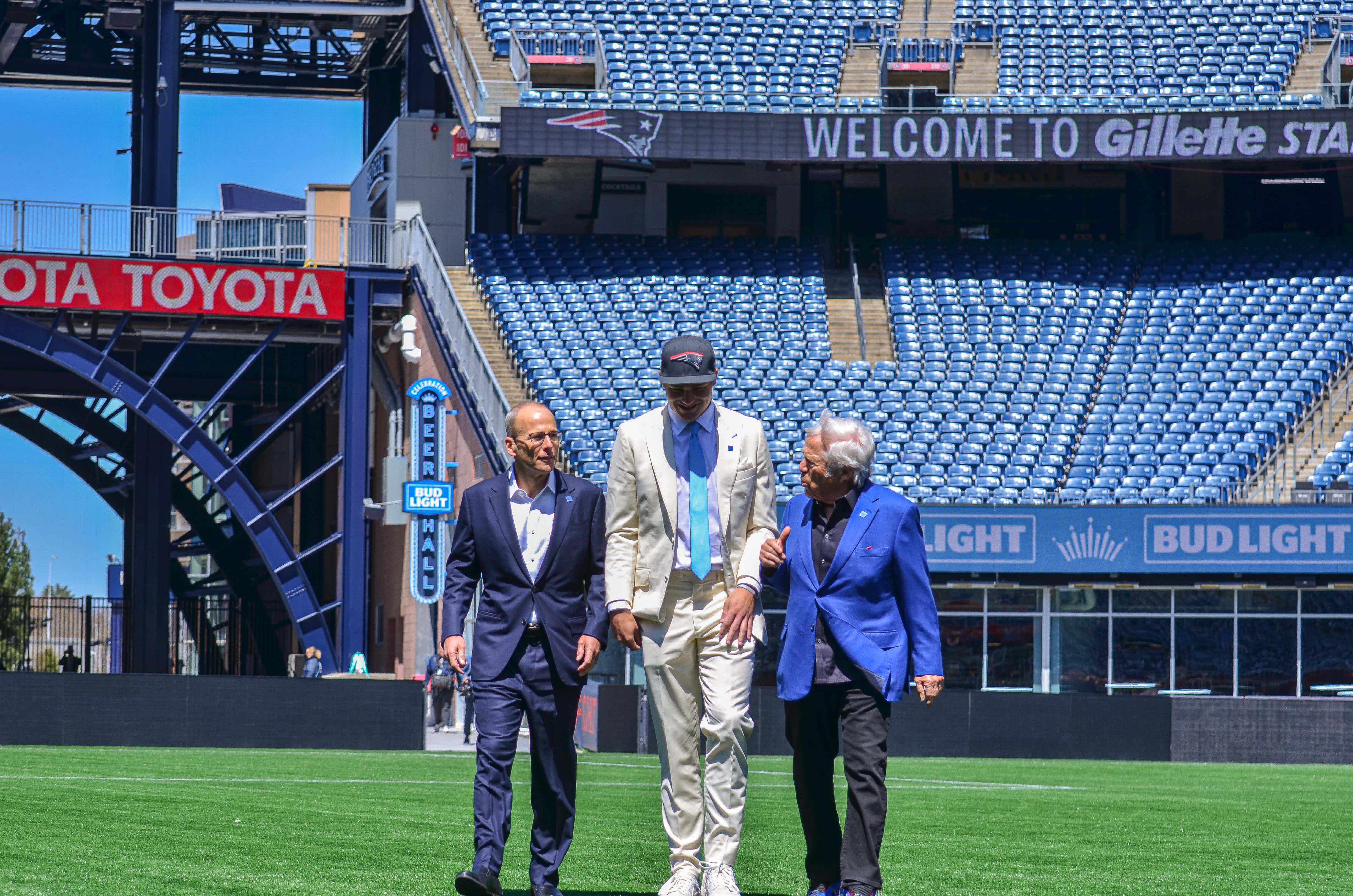 Drake Maye speaks with Robert Kraft while walking out onto the field at Gillette Stadium | Friday, April 26