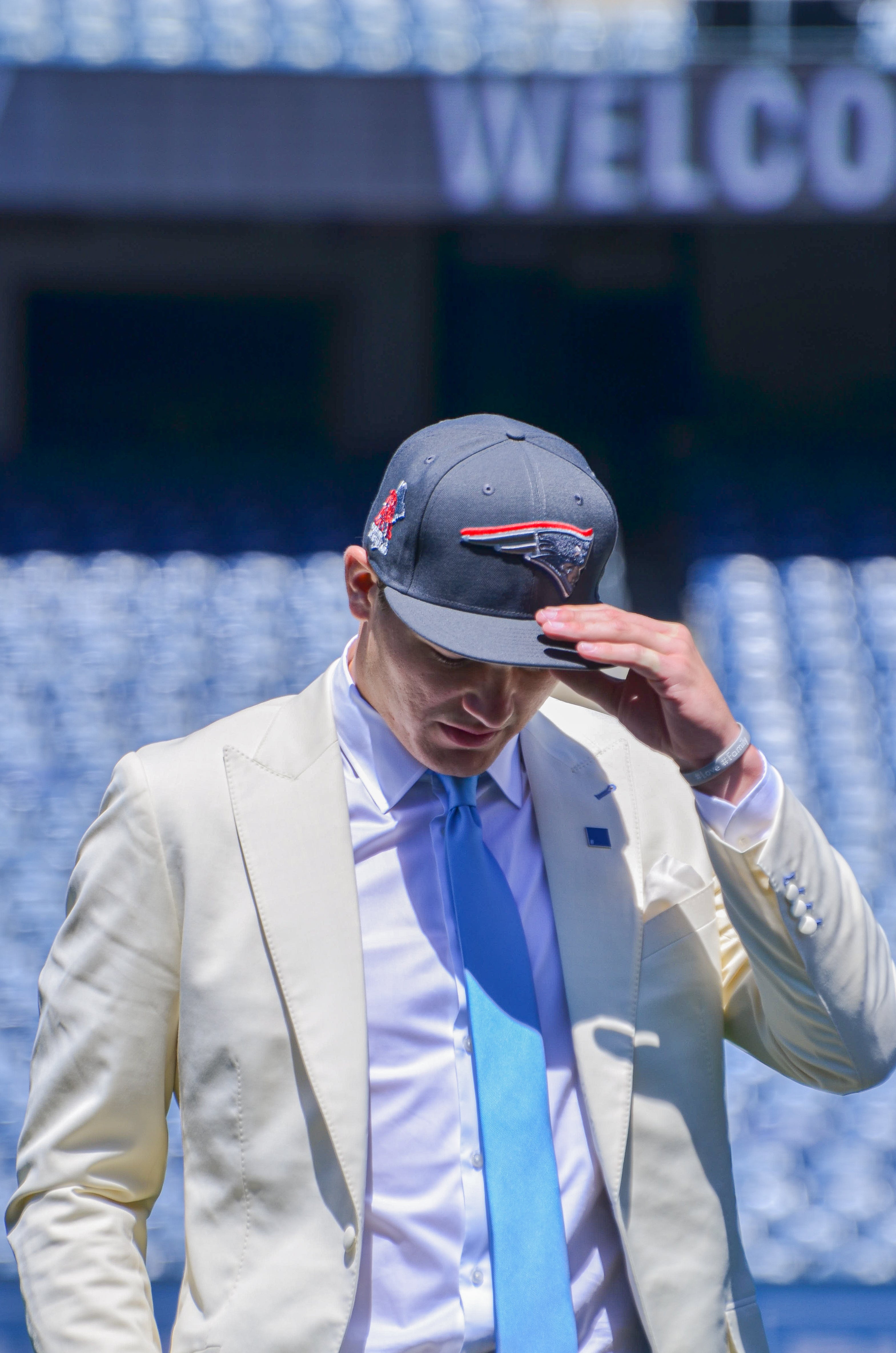 Drake Maye walks on the field at Gillette Stadium with his Patriots hat | Friday, April 26