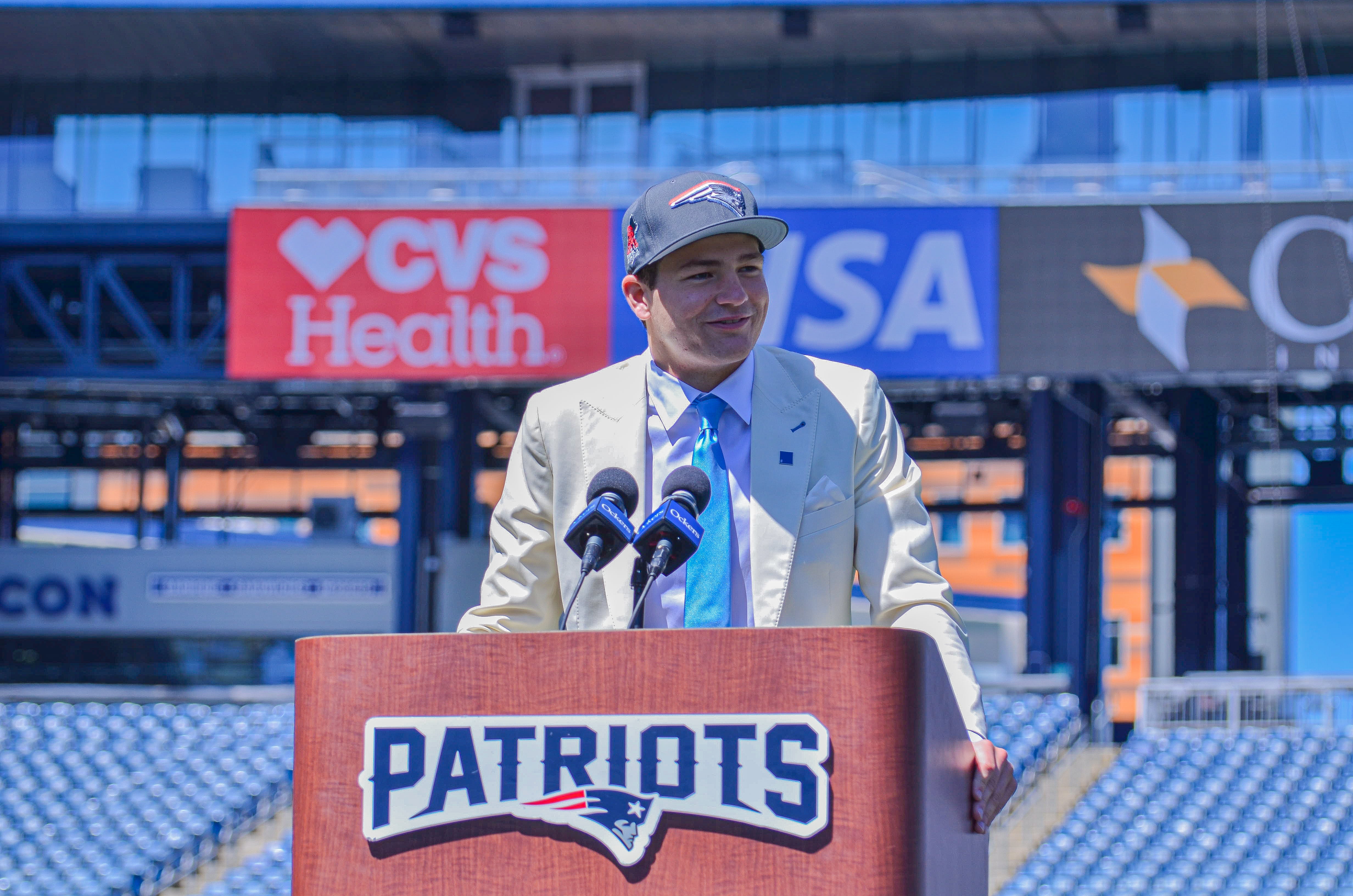 Drake Maye speaks with reporters at Gillette Stadium after accepting his jersey on Friday, April 26