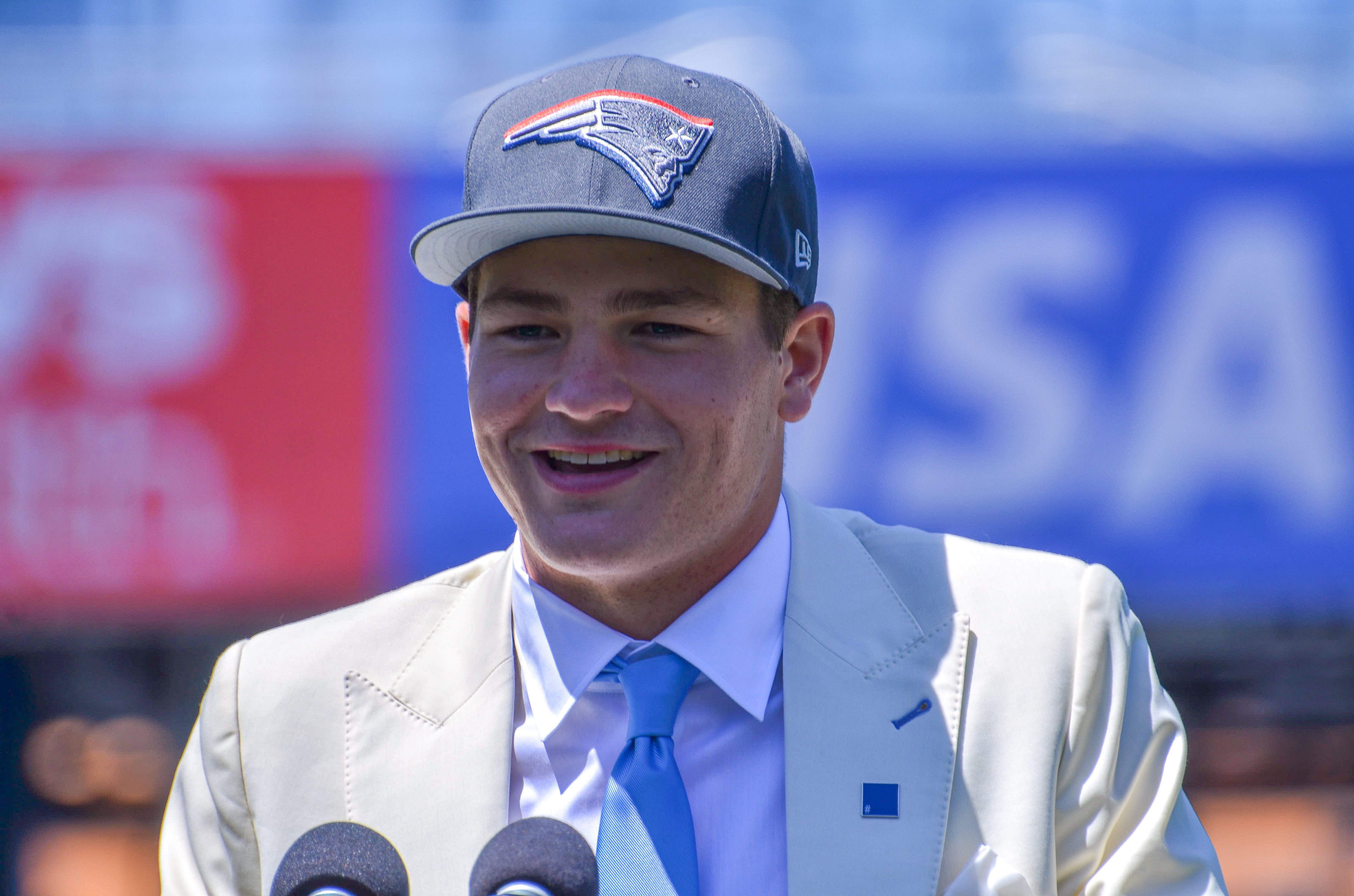 Drake Maye speaks with reporters at Gillette Stadium after accepting his jersey on Friday, April 26