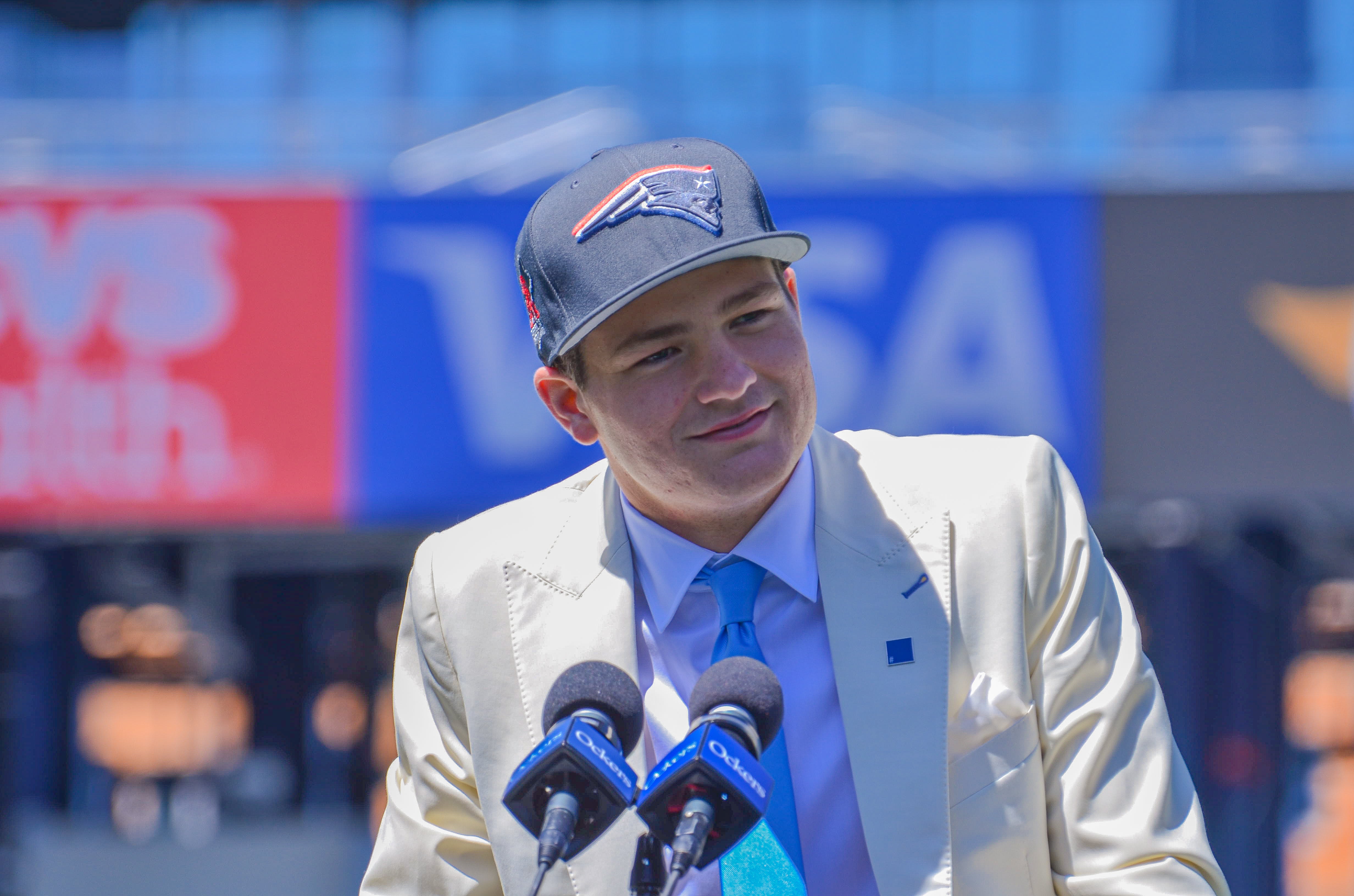 Drake Maye speaks with reporters at Gillette Stadium after accepting his jersey on Friday, April 26