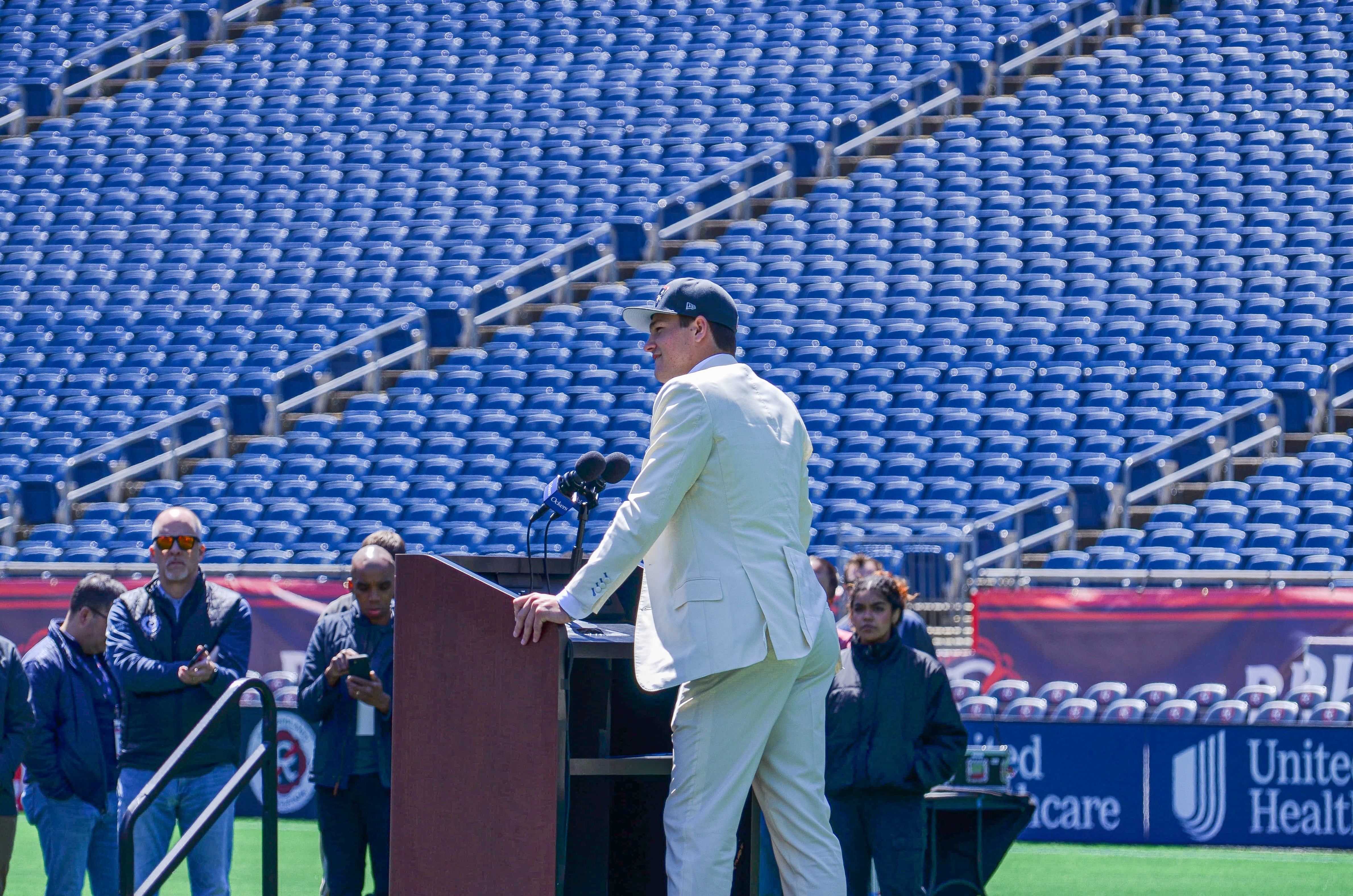 Drake Maye speaks with reporters at Gillette Stadium after accepting his jersey on Friday, April 26