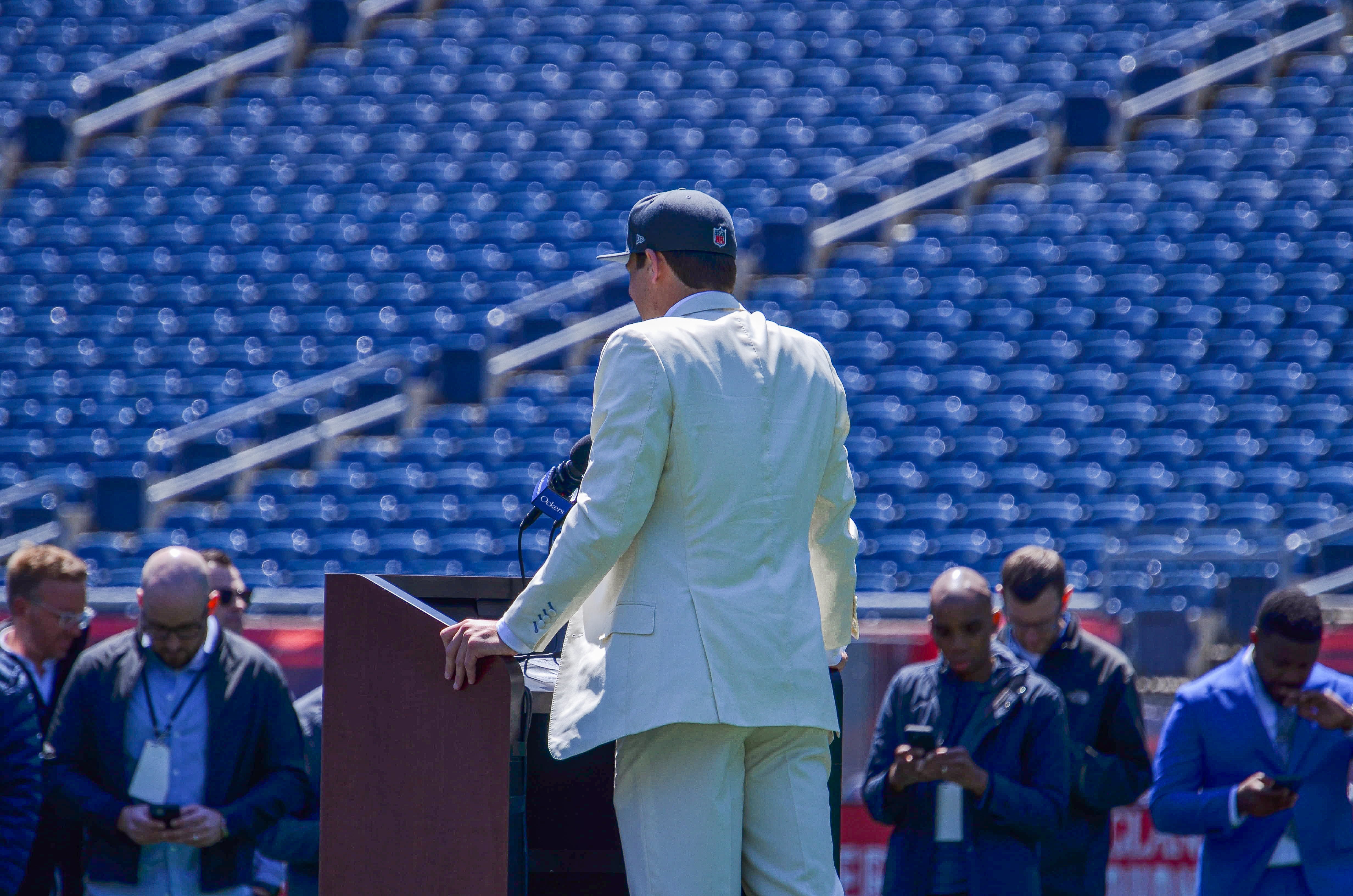 Drake Maye speaks with reporters at Gillette Stadium after accepting his jersey on Friday, April 26