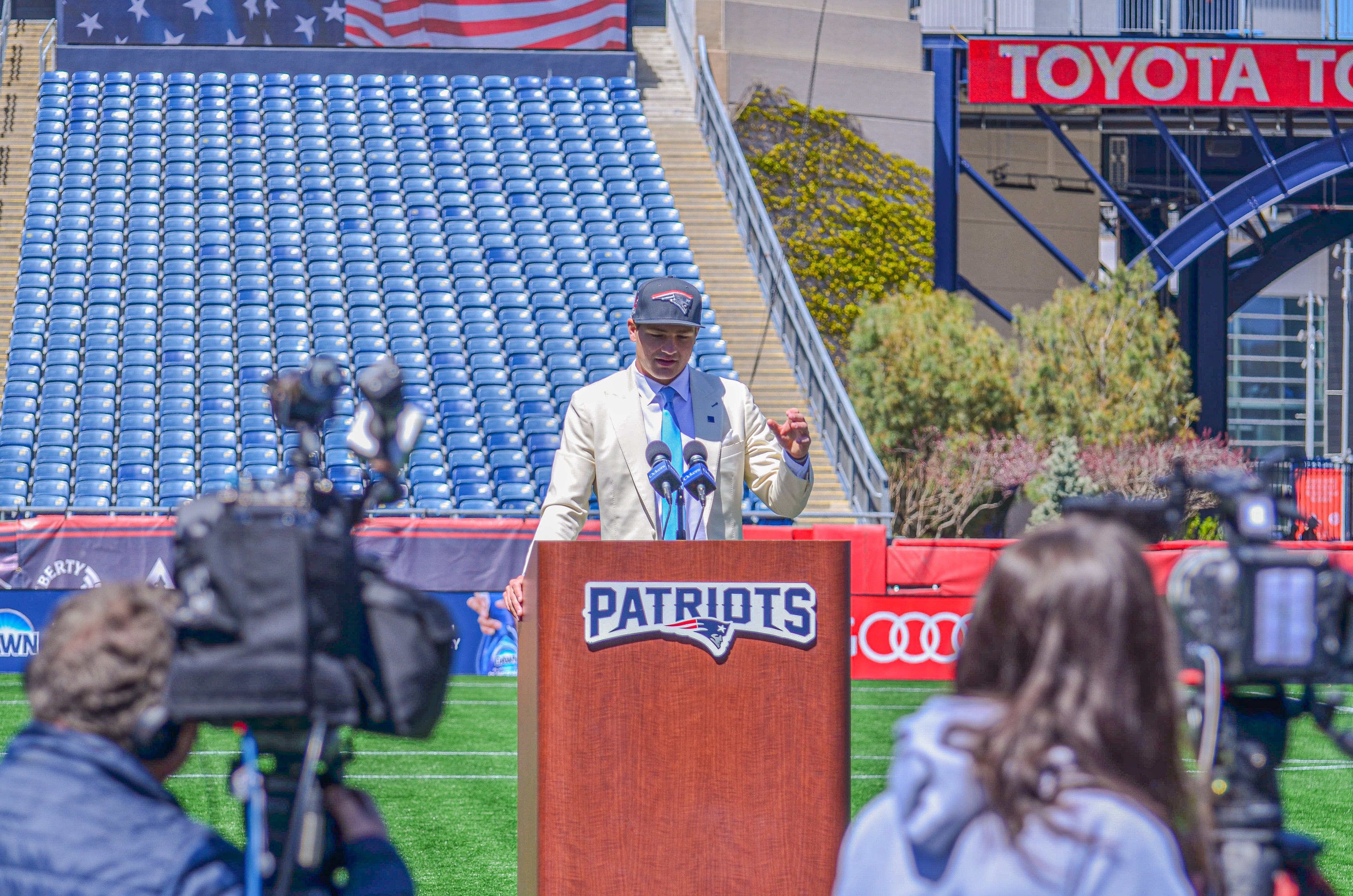 Drake Maye speaks with reporters at Gillette Stadium after accepting his jersey on Friday, April 26