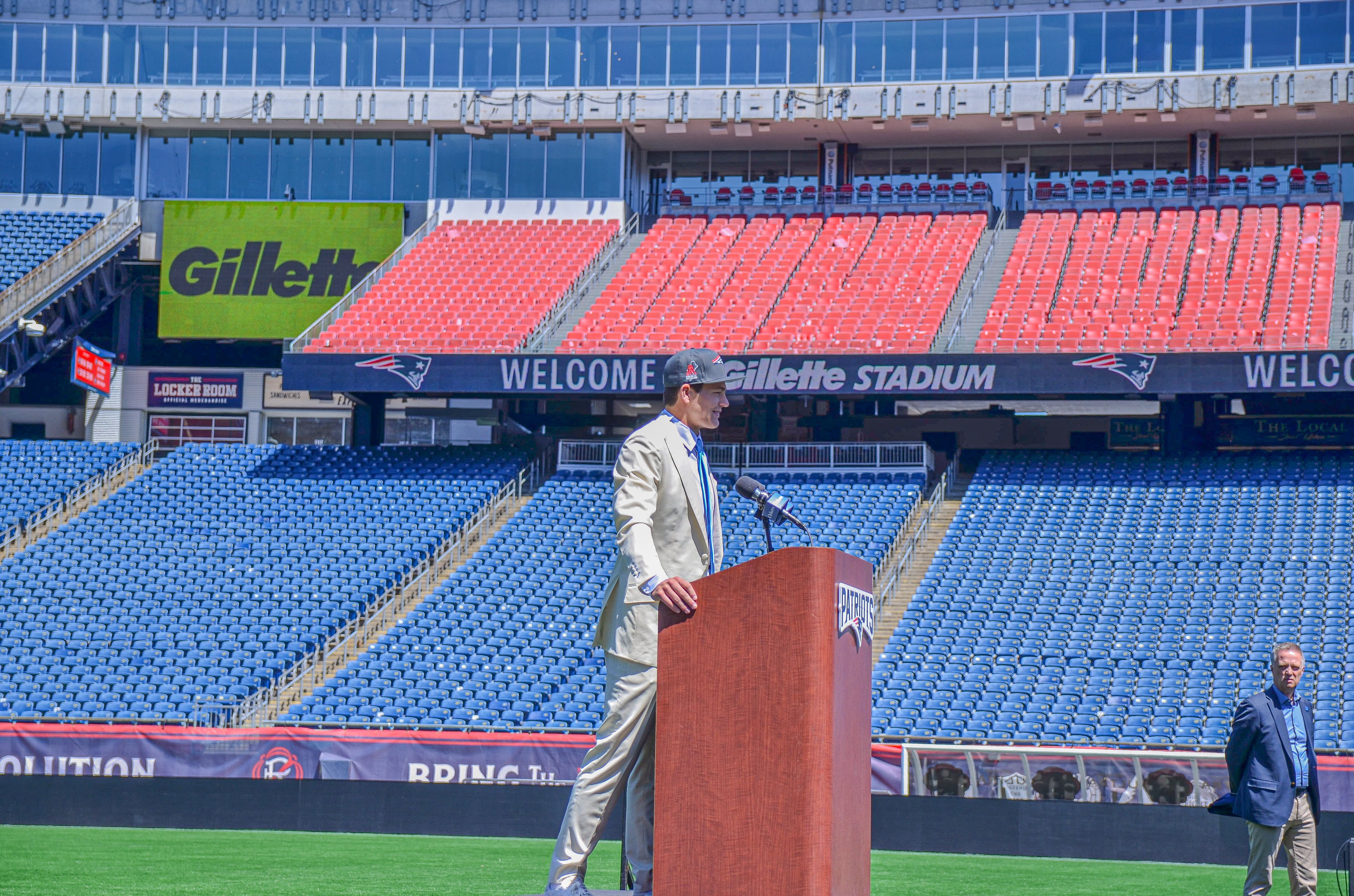 Drake Maye speaks with reporters at Gillette Stadium after accepting his jersey on Friday, April 26