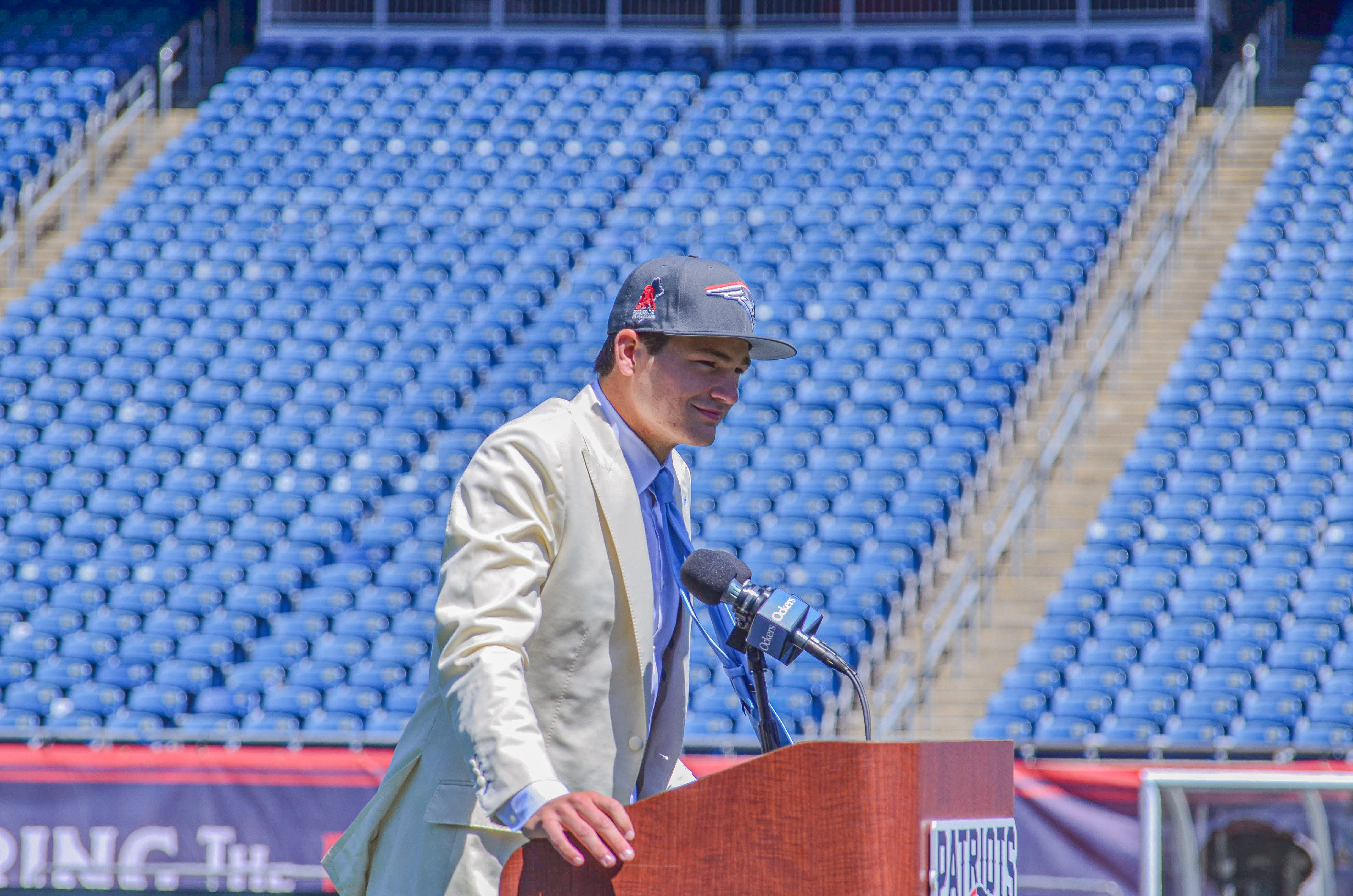 Drake Maye speaks with reporters at Gillette Stadium after accepting his jersey on Friday, April 26
