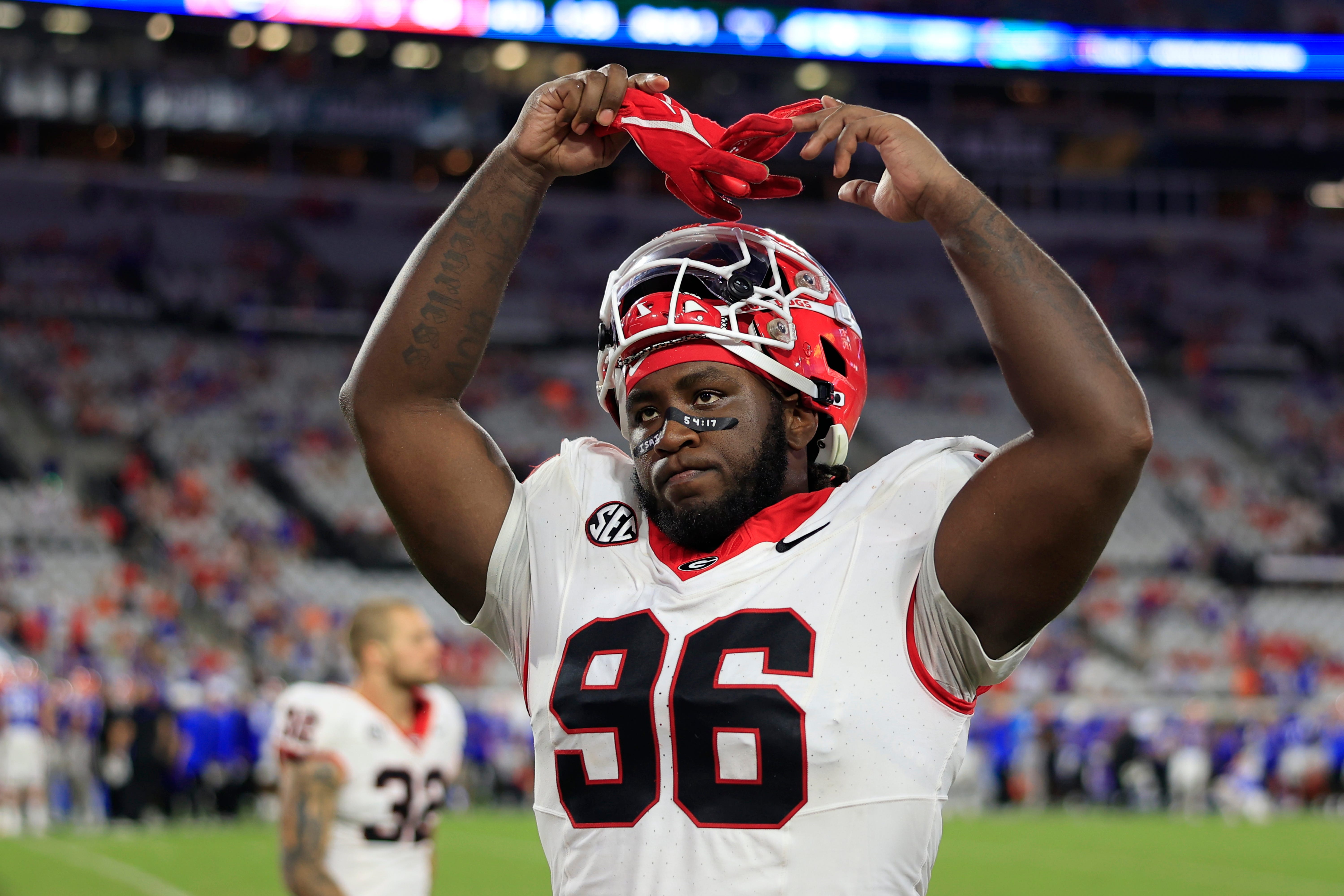 Georgia Bulldogs defensive lineman Zion Logue (96) pumps up the crowd as seconds wind down during the fourth quarter of an NCAA football game Saturday, Oct. 28, 2023 at EverBank Stadium in Jacksonville.
