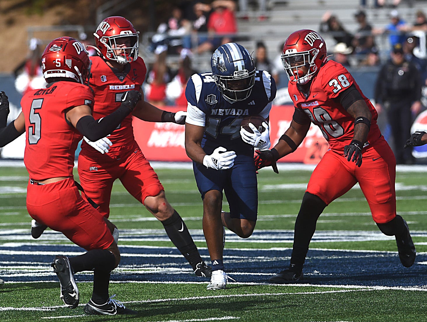 Nevada s John Jackson looks to run while taking on UNLV at Mackay Stadium in Reno on Oct. 14, 2023.  