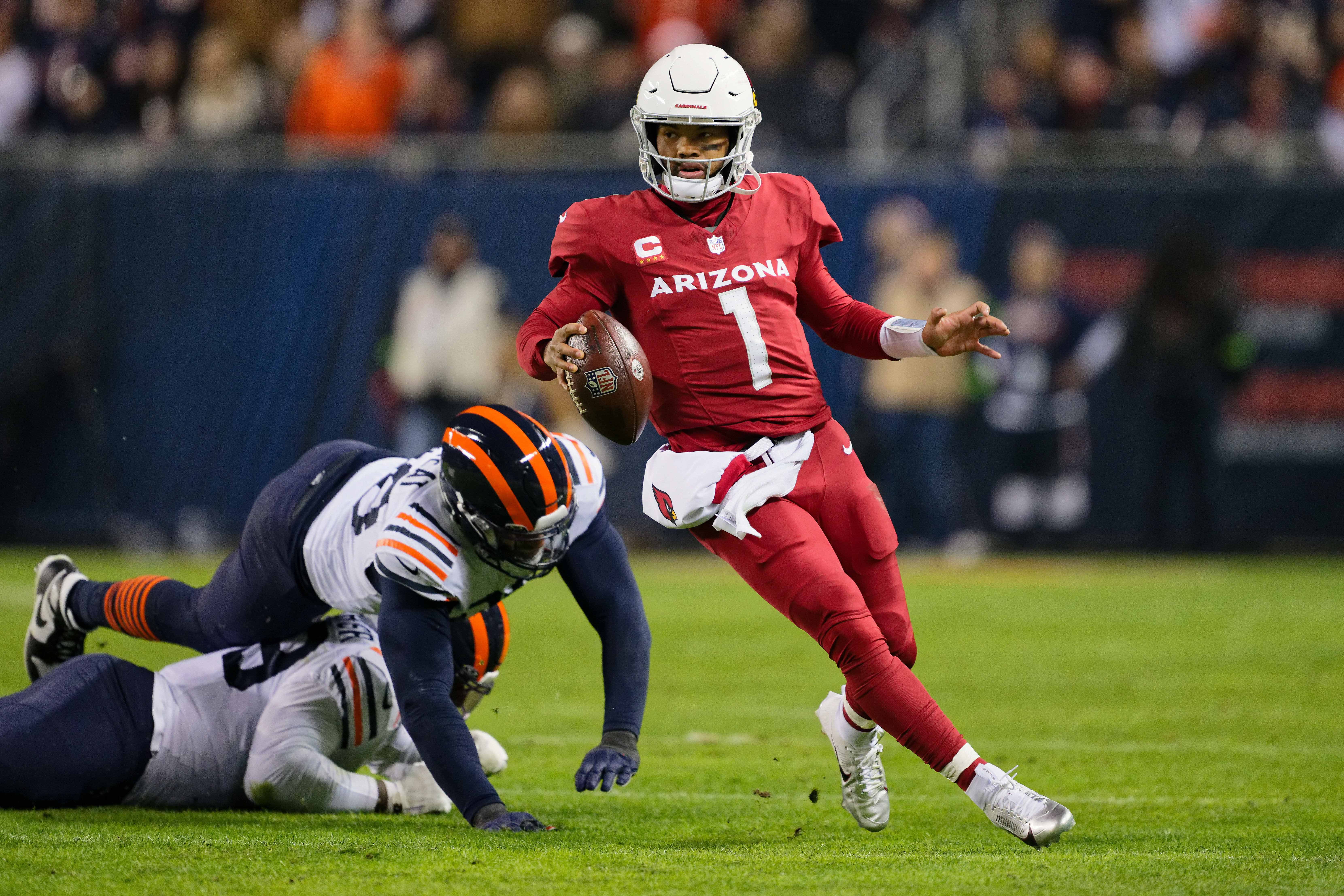 Dec 24, 2023; Chicago, Illinois, USA; Arizona Cardinals quarterback Kyler Murray (1) runs with the ball against the Chicago Bears at Soldier Field.