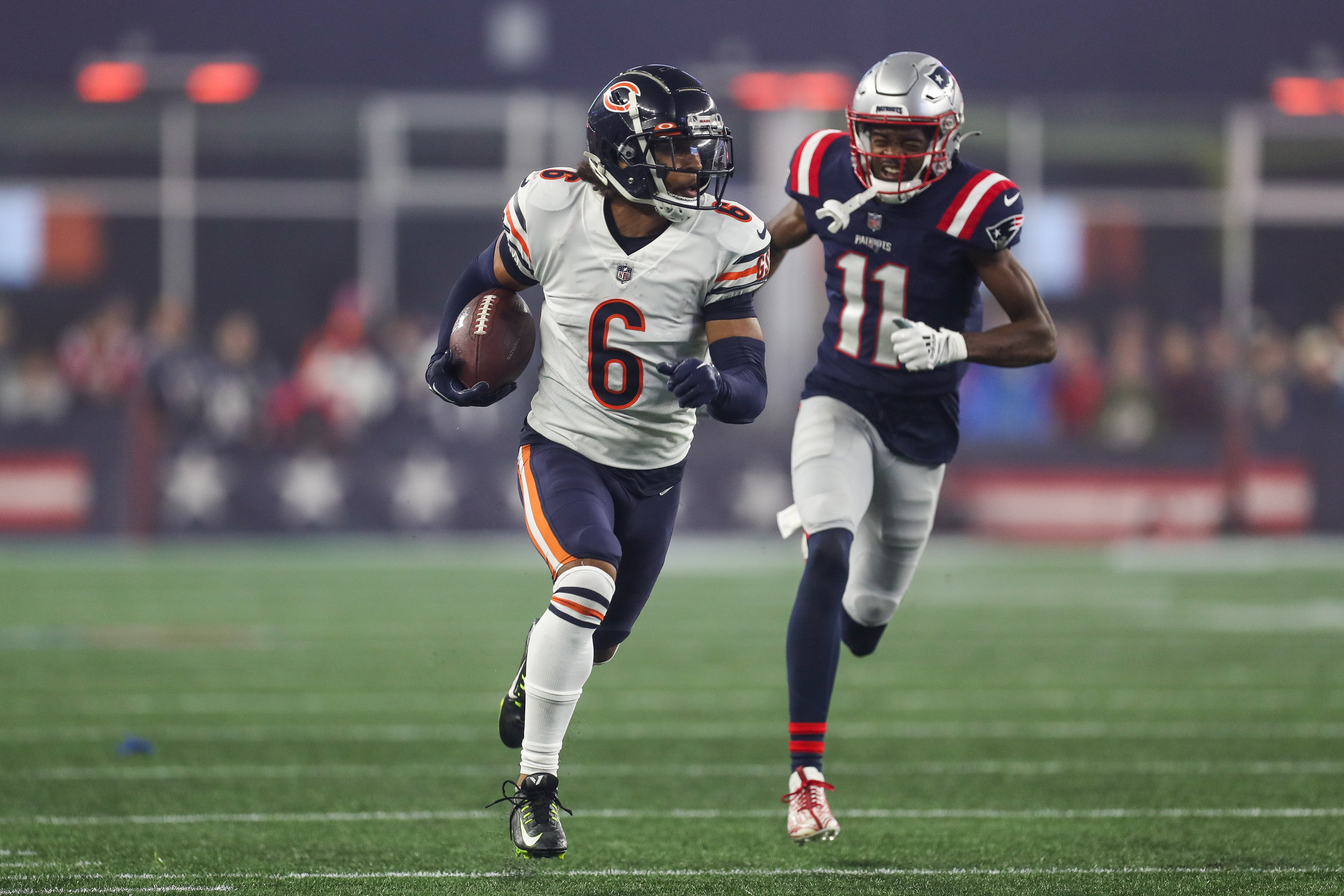 Oct 24, 2022; Foxborough, Massachusetts, USA; Chicago Bears cornerback Kyler Gordon (6) runs the ball after an interception during the second half against the New England Patriots at Gillette Stadium.
