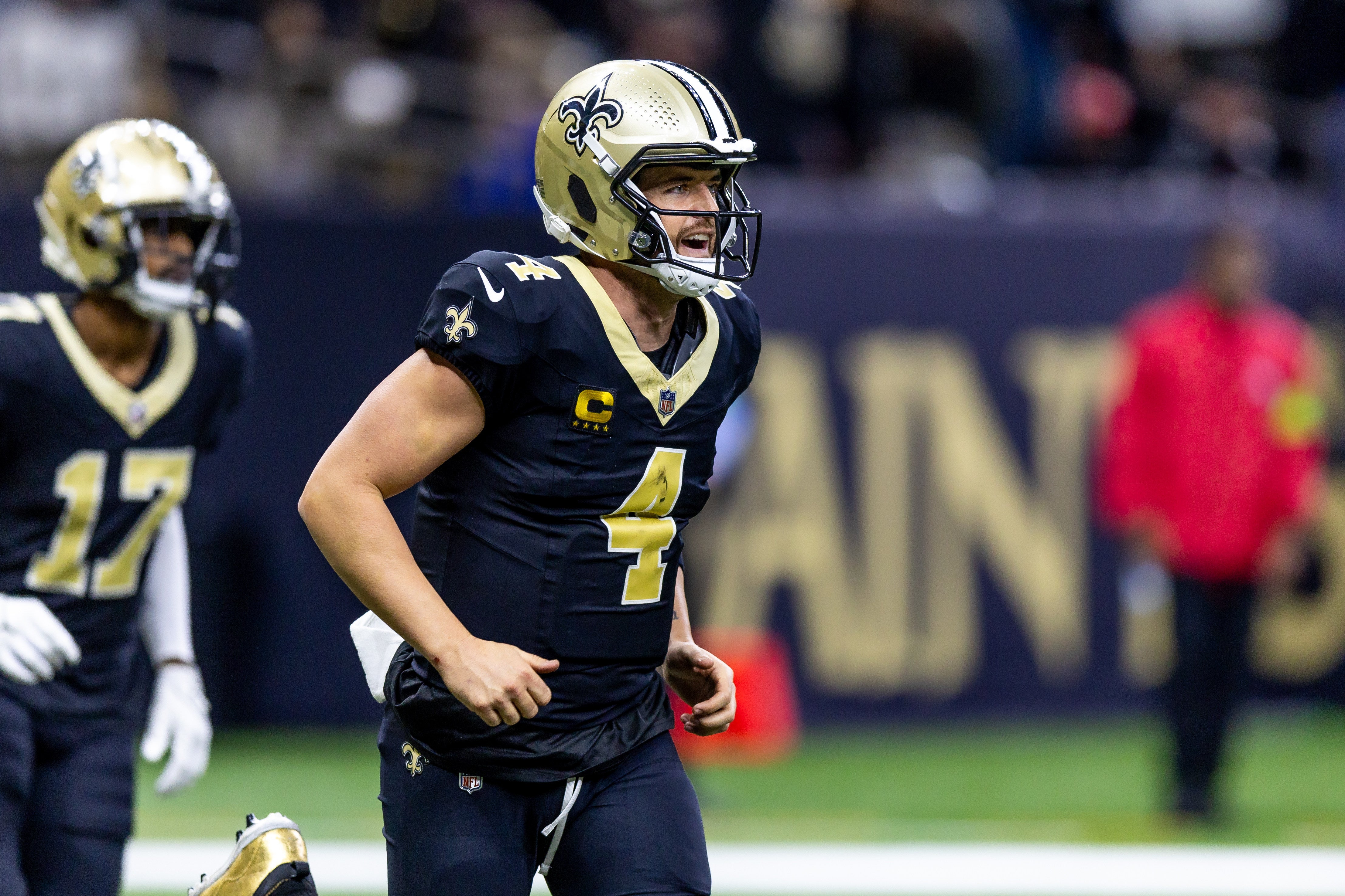 Jan 7, 2024; New Orleans, Louisiana, USA; New Orleans Saints quarterback Derek Carr (4) celebrates a touchdown pass against the Atlanta Falcons during the second half at Caesars Superdome.