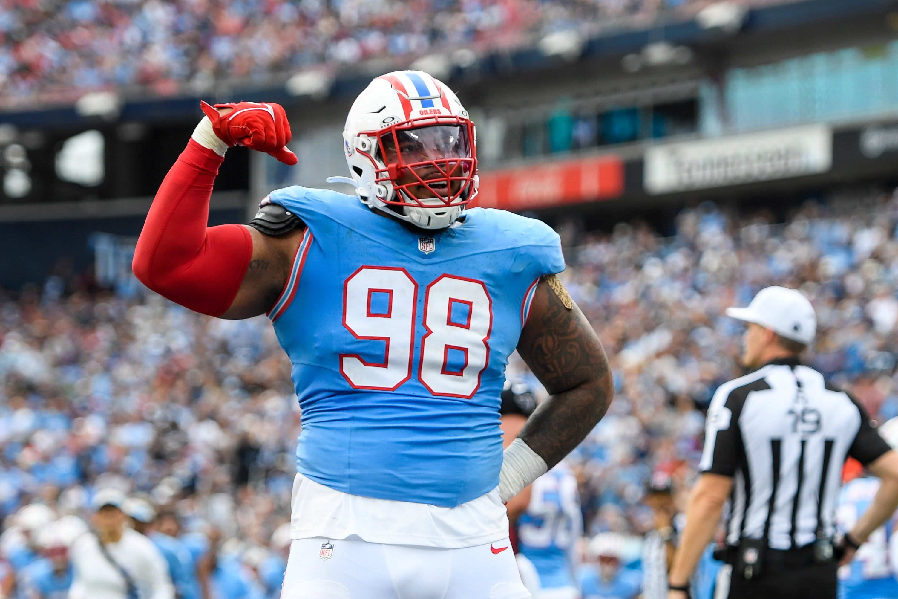 Oct 29, 2023; Nashville, Tennessee, USA; Tennessee Titans defensive tackle Jeffery Simmons (98) flexes after a tackle against the Atlanta Falcons during the first half at Nissan Stadium.