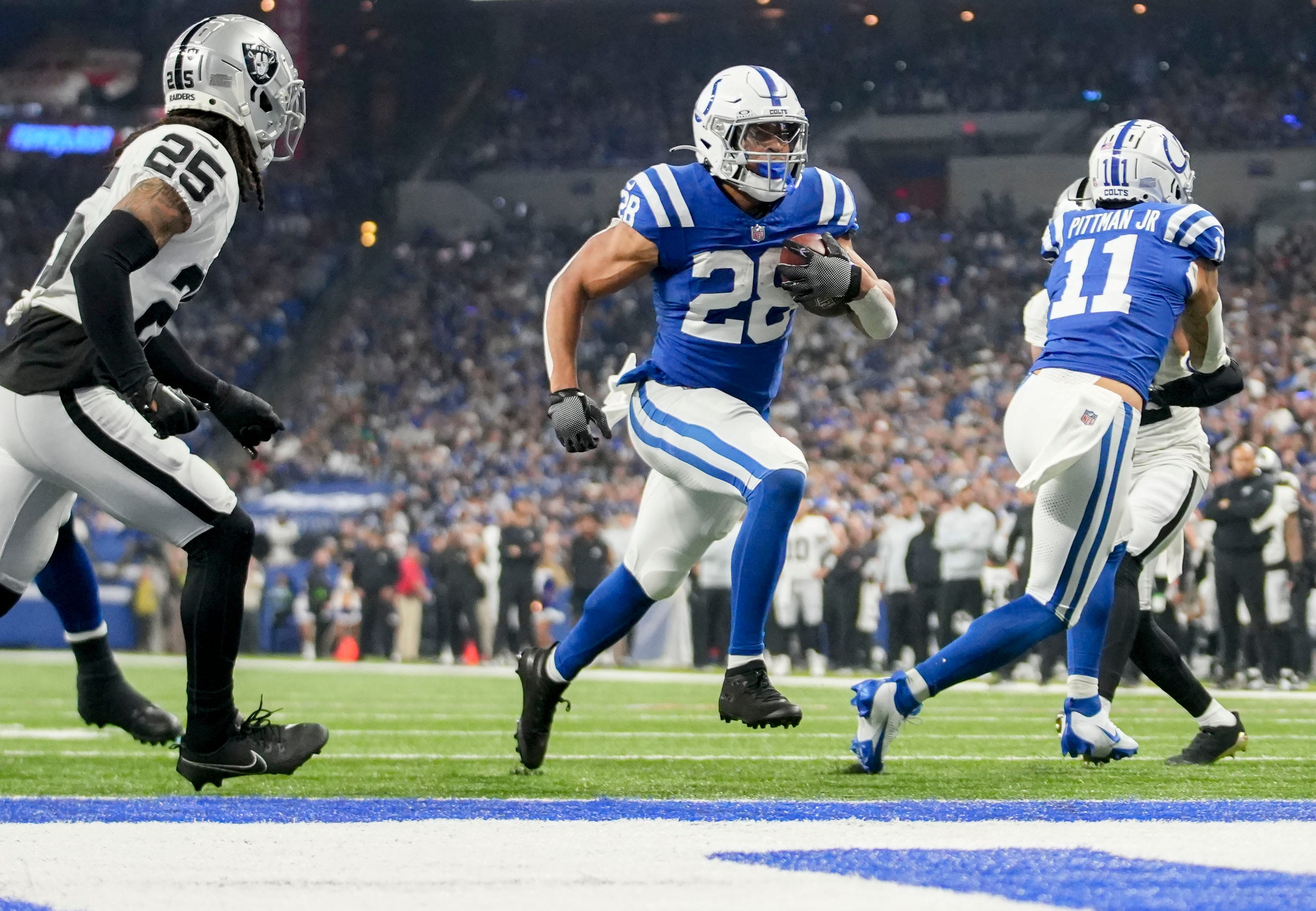 Indianapolis Colts running back Jonathan Taylor (28) rushes for a touchdown Sunday, Dec. 31, 2023, during a game against the Las Vegas Raiders at Lucas Oil Stadium in Indianapolis.