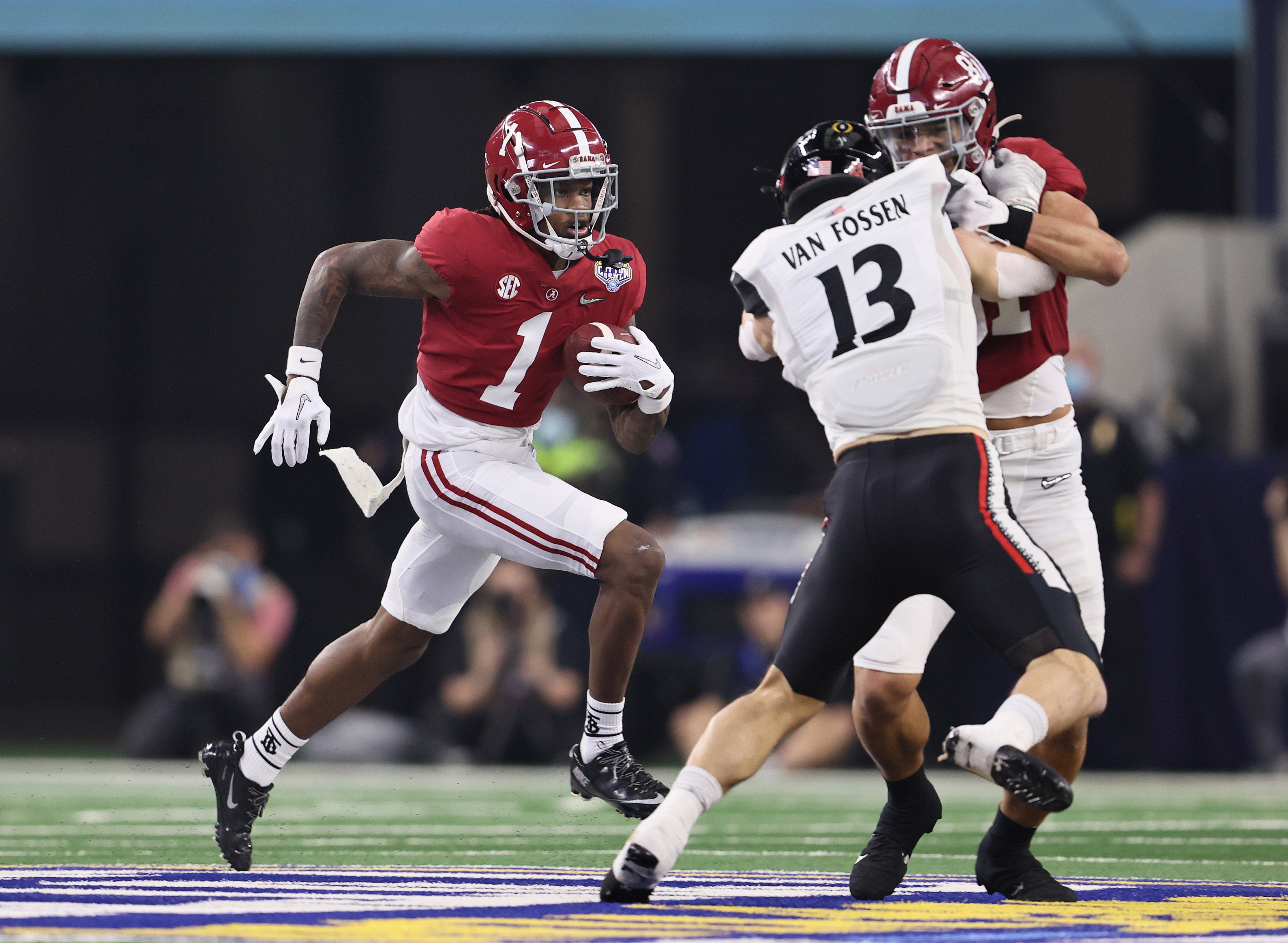 Dec 31, 2021; Arlington, Texas, USA; Alabama Crimson Tide receiver Jameson Williams (1) runs a sweep in the first quarter against the Cincinnati Bearcats during the 2021 Cotton Bowl college football CFP national semifinal game at AT&T Stadium. Mandatory Credit: Matthew Emmons-USA TODAY Sports  
