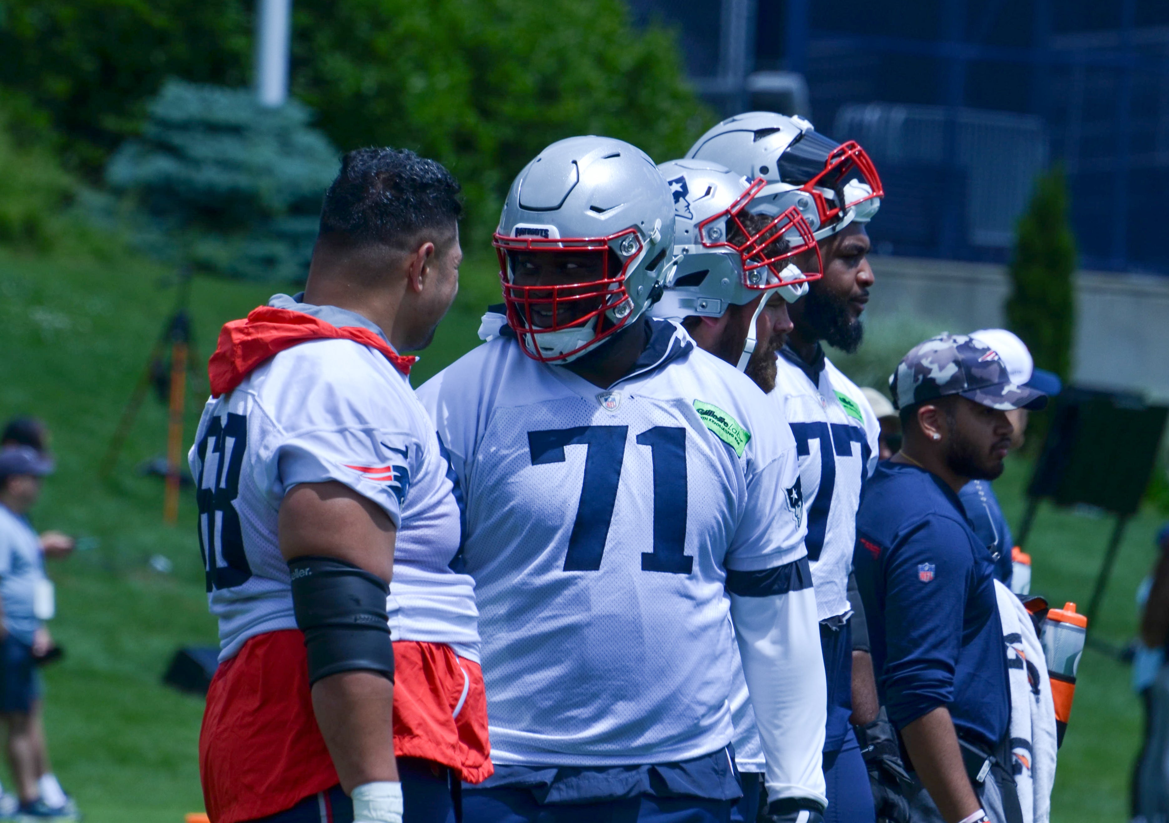 Patriots OL Atonio Mafi talks with OT Mike Onwenu at OTAs - May 29, 2024