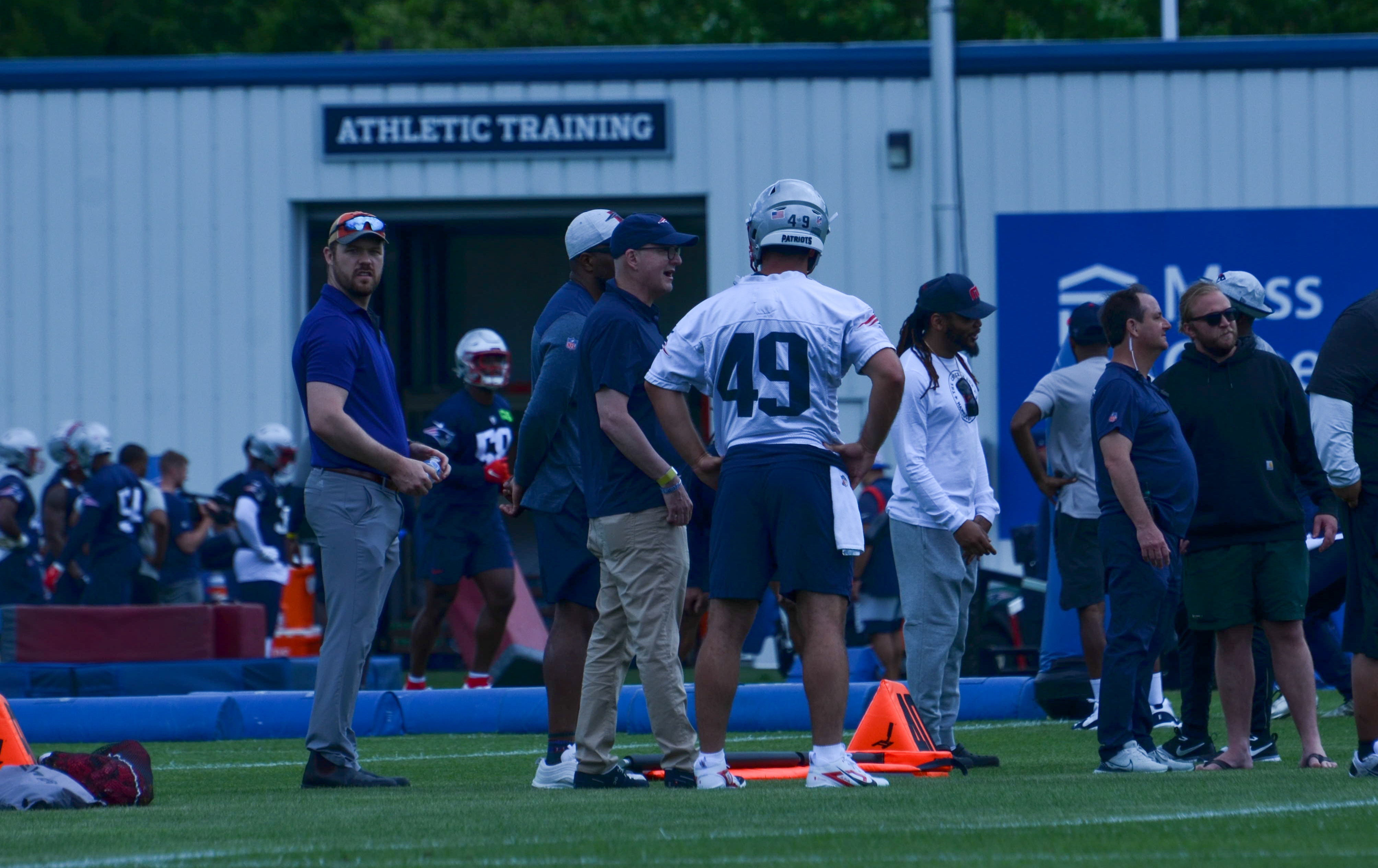 Patriots LS Joe Cardona speaks with coaches at OTAs - May 29, 2024