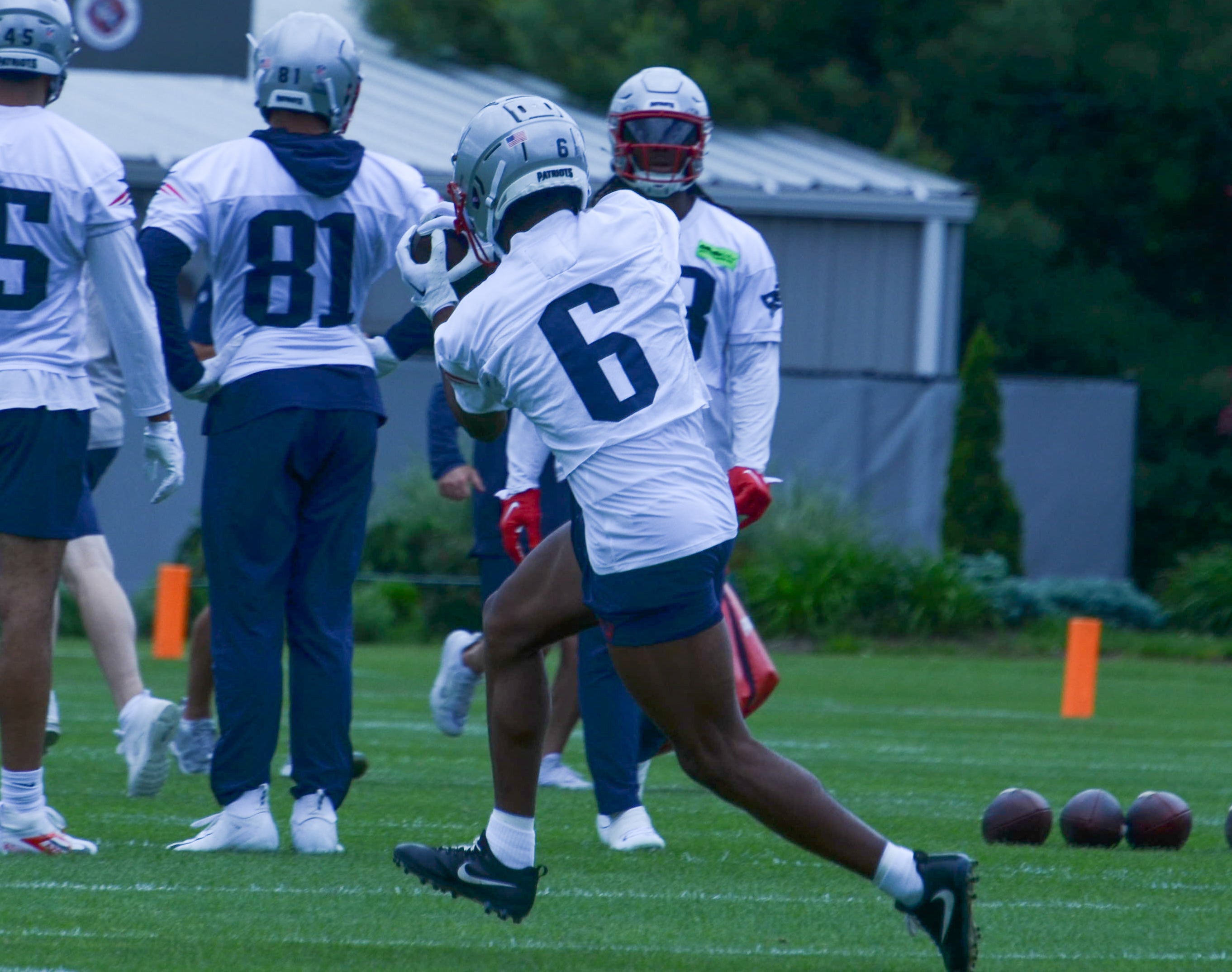 Patriots WR Javon Baker catches a ball during wide receiver drills at OTAs - May 29, 2024