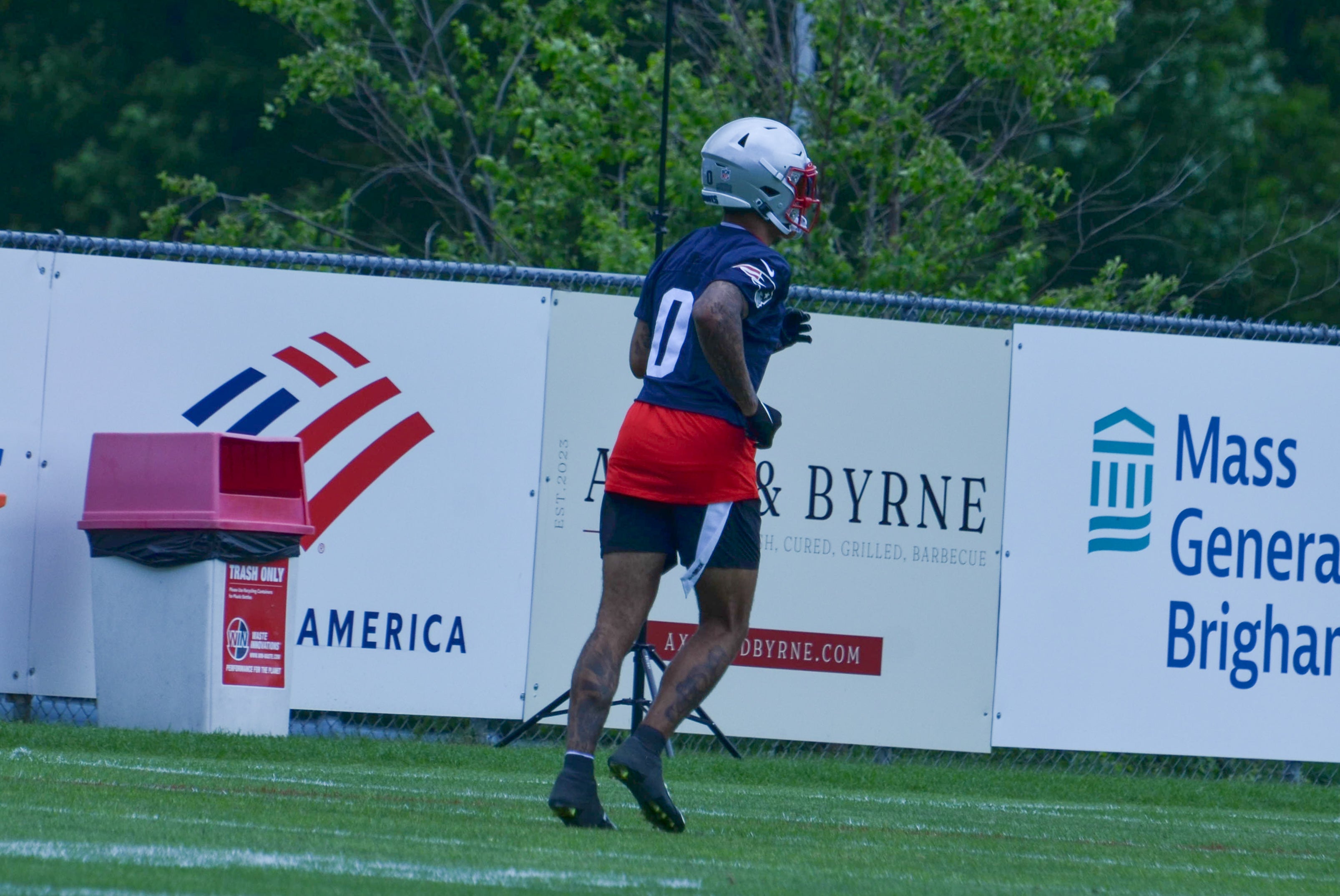 Cornerback Christian Gonzalez runs on the field at Gillette Stadium -  May 29, 2024