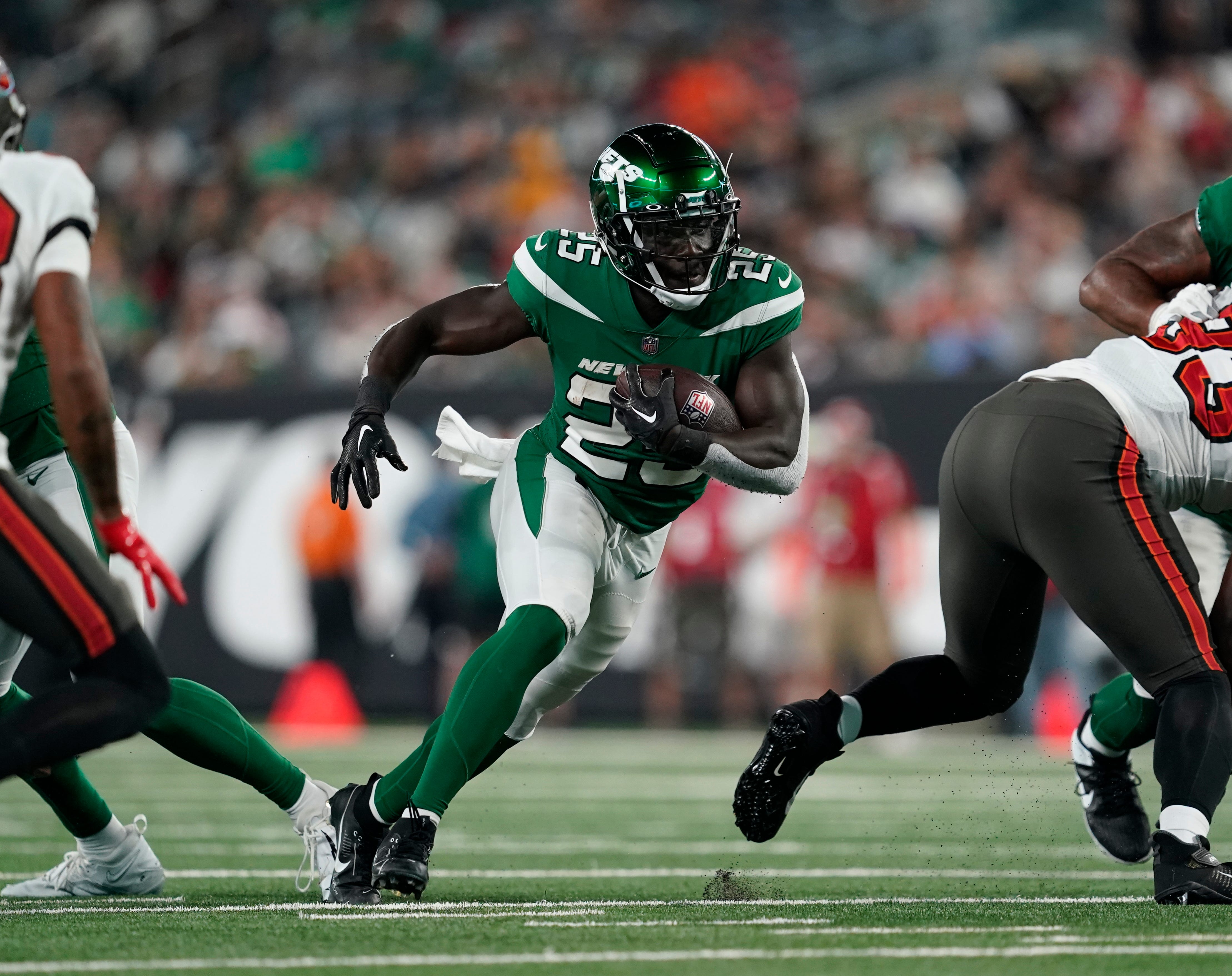 New York Jets running back Israel Abanikanda (25) rushes with the ball in the second half. The Buccaneers defeat the Jets, 13-6, in a preseason NFL game at MetLife Stadium on Saturday, Aug. 19, 2023, in East Rutherford.