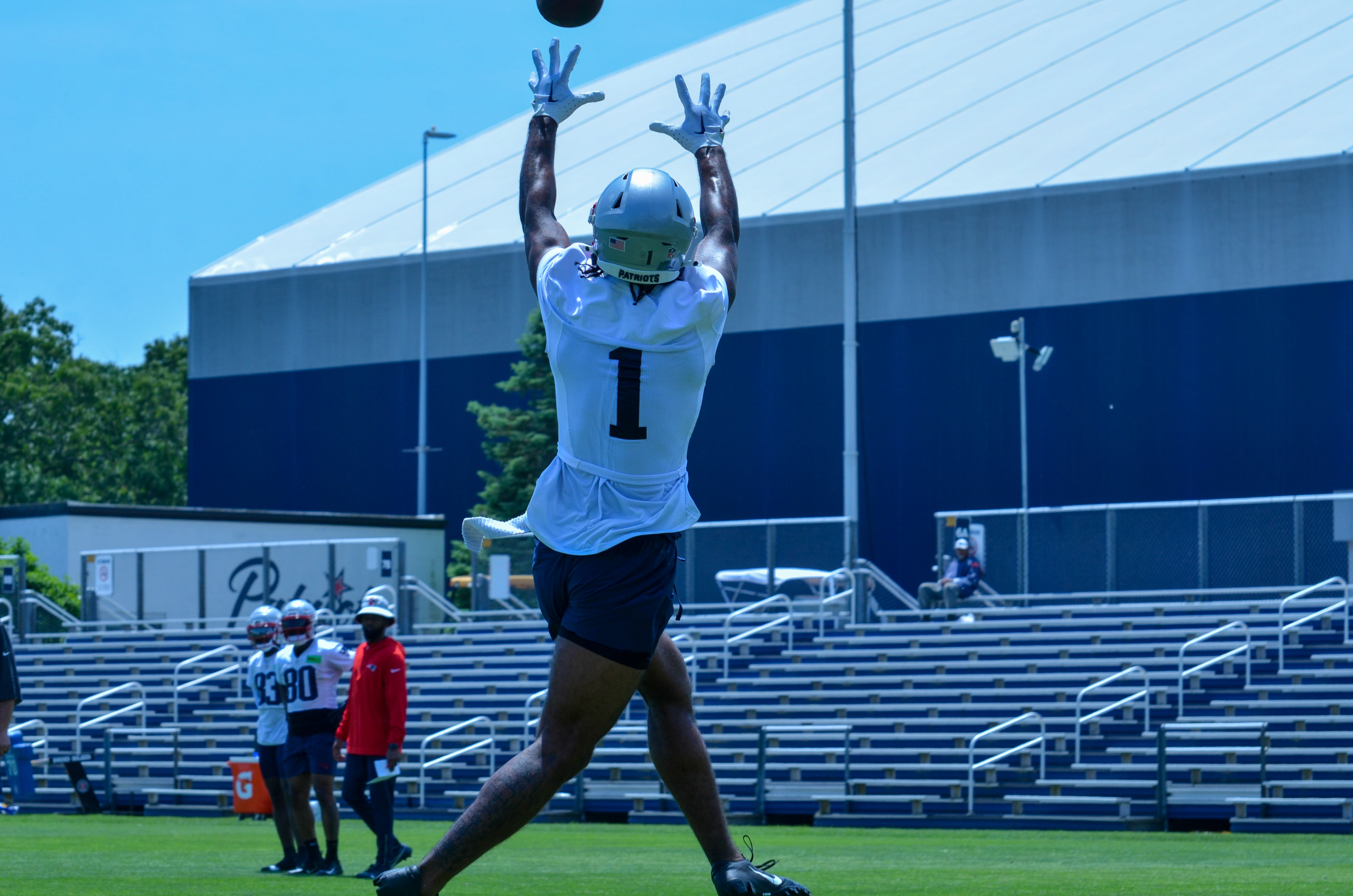 Patriots WR Ja'Lynn Polk jumps up into the air during drills to catch the ball at Tuesday's OTAs - June 4, 2024