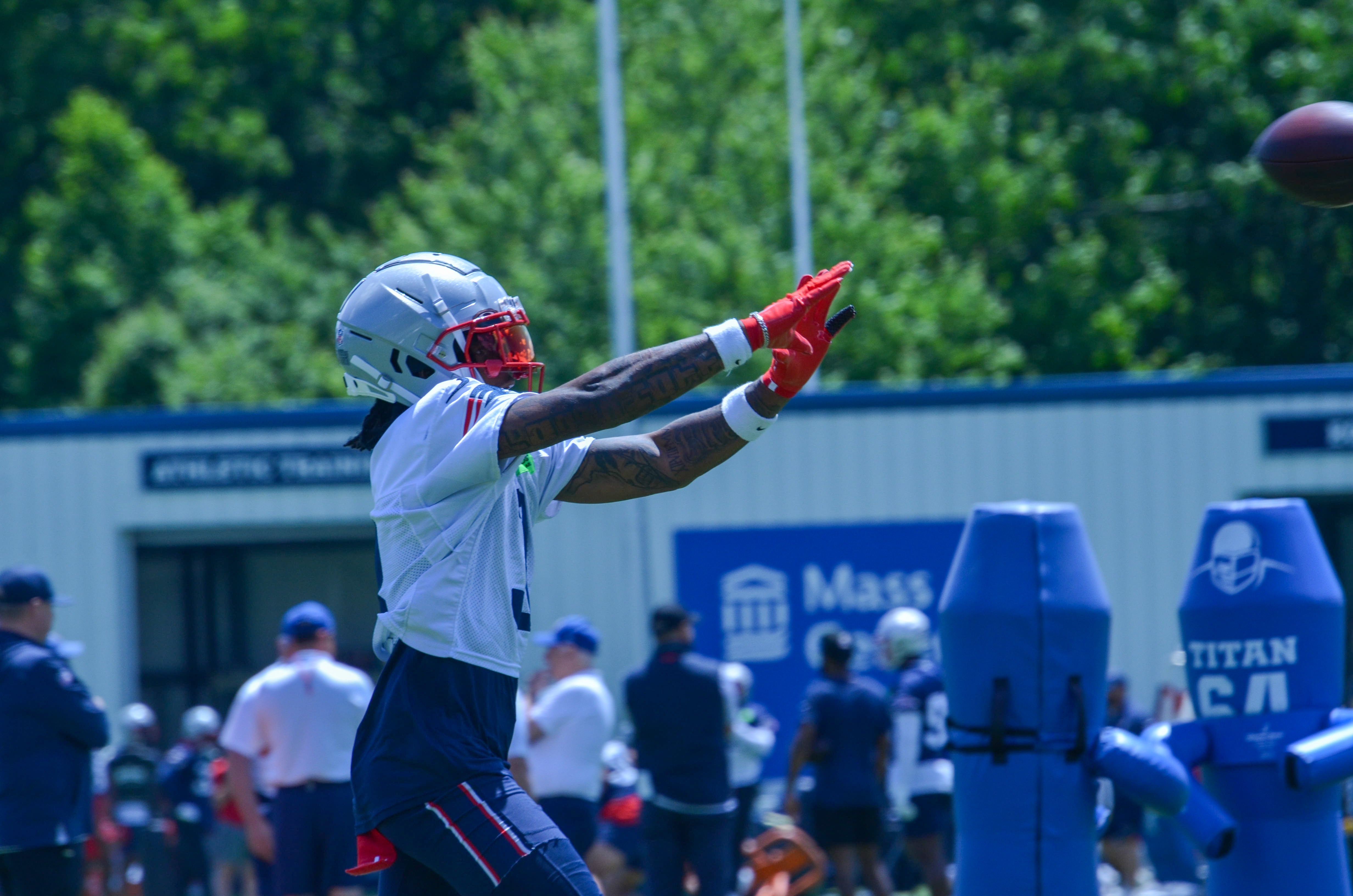 Patriots WR DeMario Douglas reaching out to make a catch during the first day of Mandatory Minicamp at Gillette Stadium - June 10, 2024