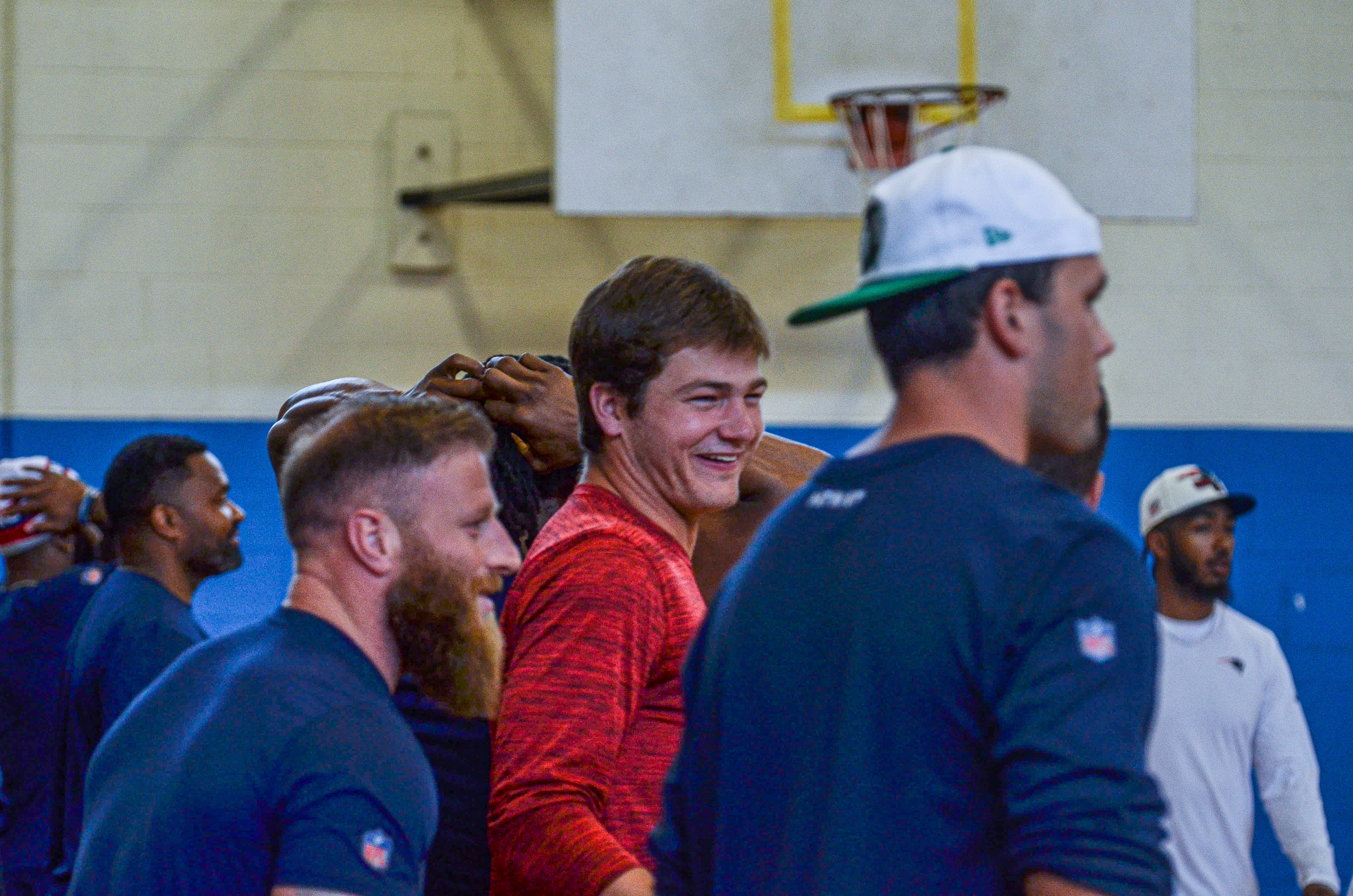 Quarterback Drake Maye laughs with his teammates at the New England Patriots community event at the Perkins Community Center/Lee School - June 11, 2024